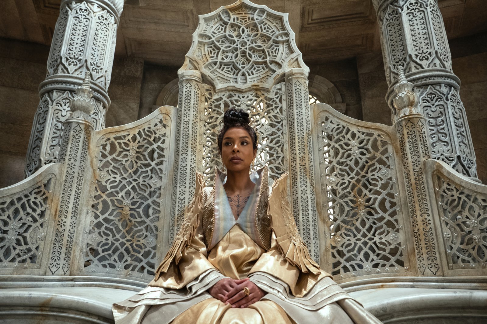 Sophie Okonedo as Siuan in 'The Wheel of Time' Episode 6. She's wearing a gold and white dress.