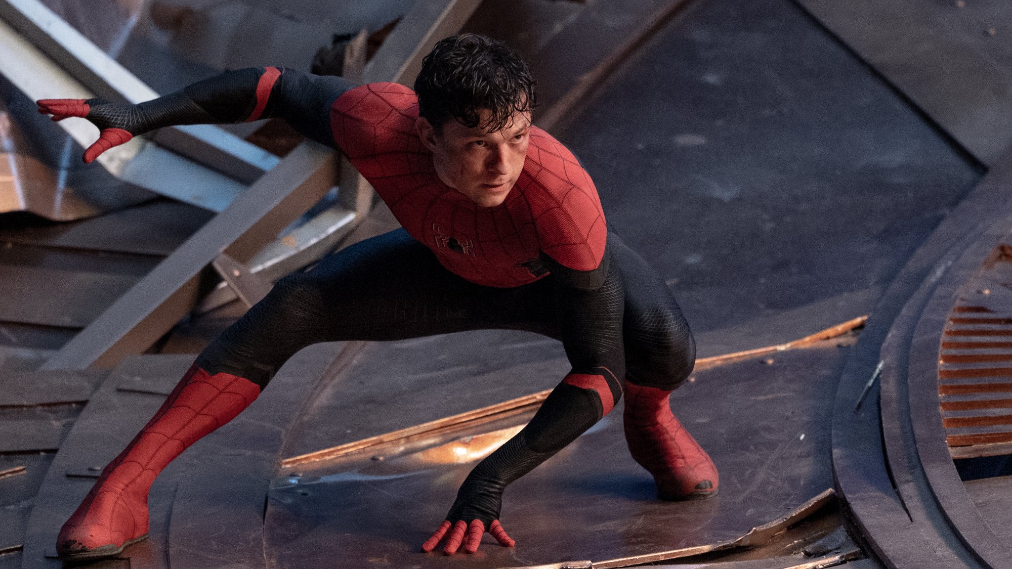 'Spider-Man: No Way Home' Tom Holland as Spider-Man/Peter Parker crouching without the Spider-Man mask