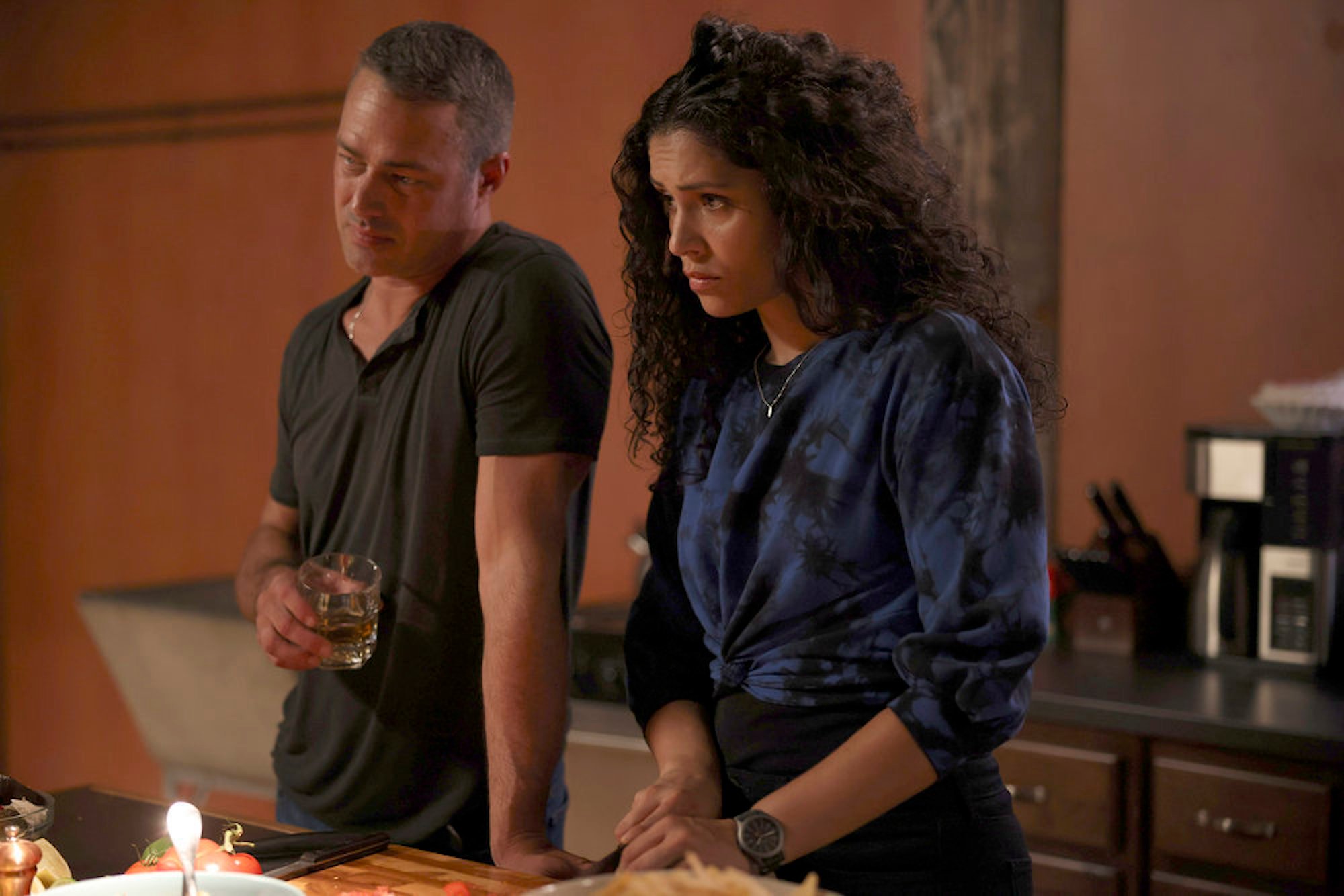 Kelly Severide standing next to Stella Kidd in the kitchen. Stella Kidd returns in the 'Chicago Fire' Season 10 fall finale