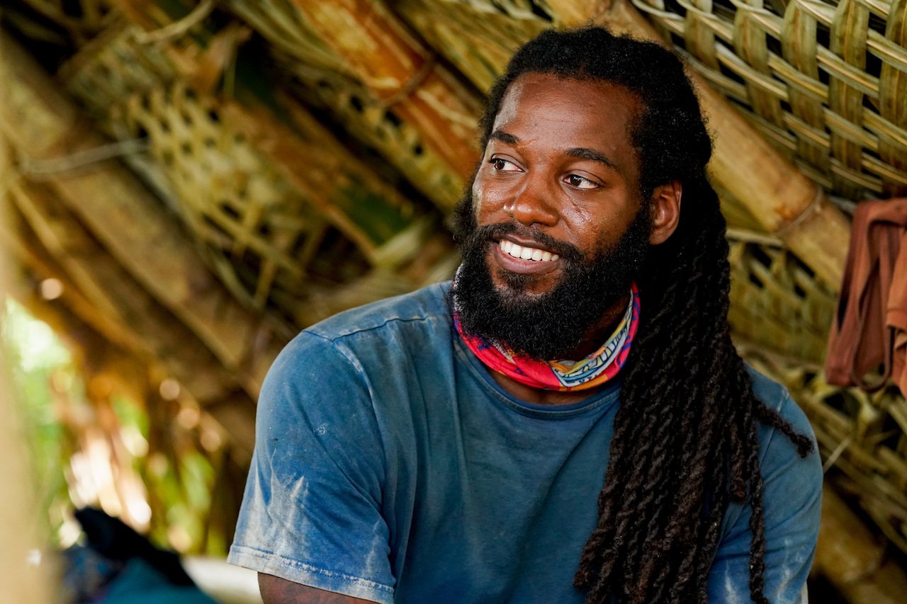Danny McCray on 'Survivor 41' is sitting down smiling.