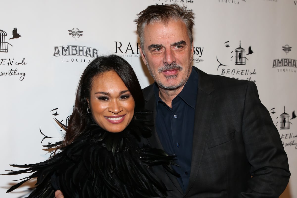 Tara Wilson and Chris Noth pose together at an event.