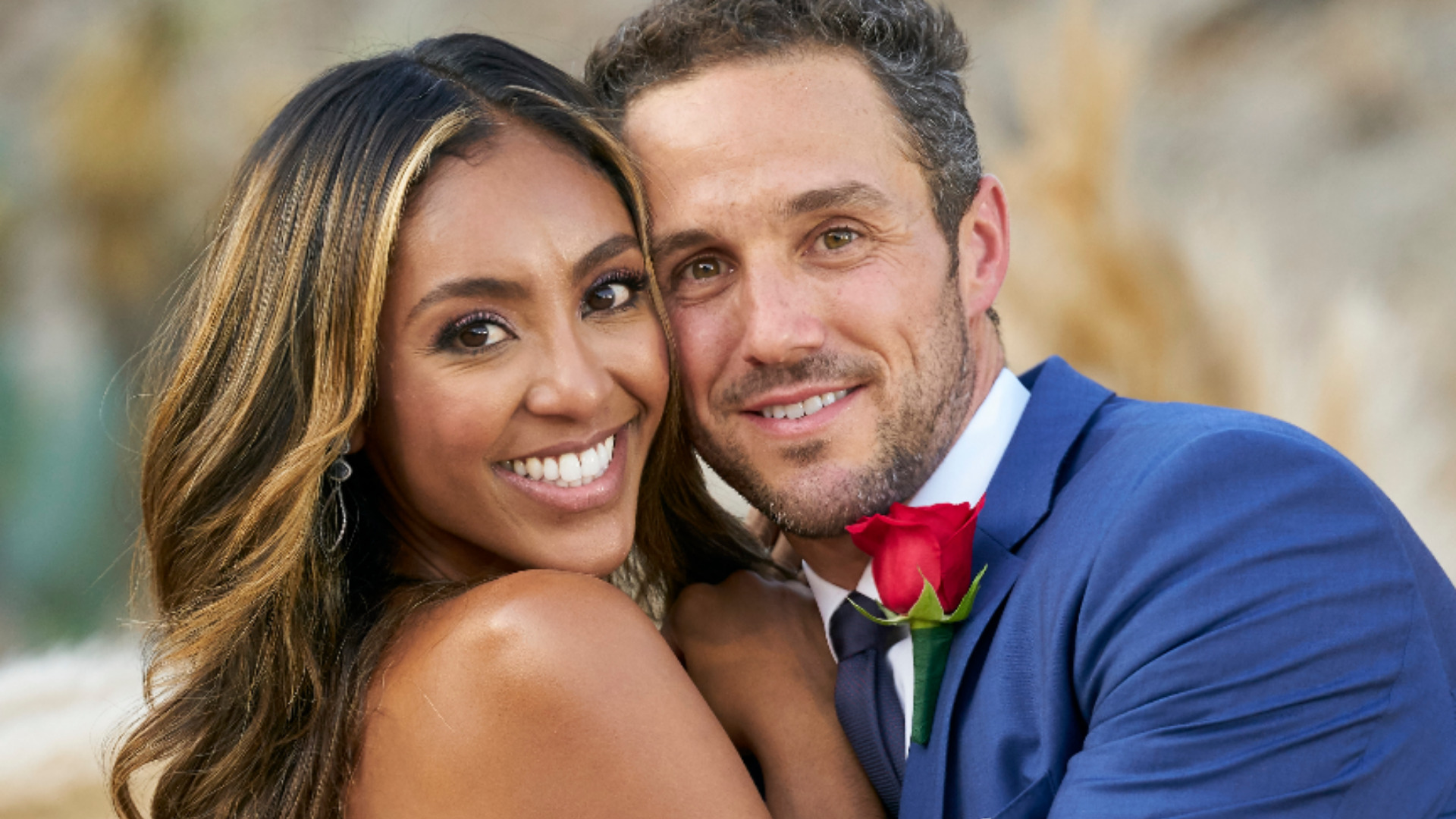 Tayshia Adams and Zac Clark pose together after getting engaged in ‘The Bachelorette’ Season 16 finale
