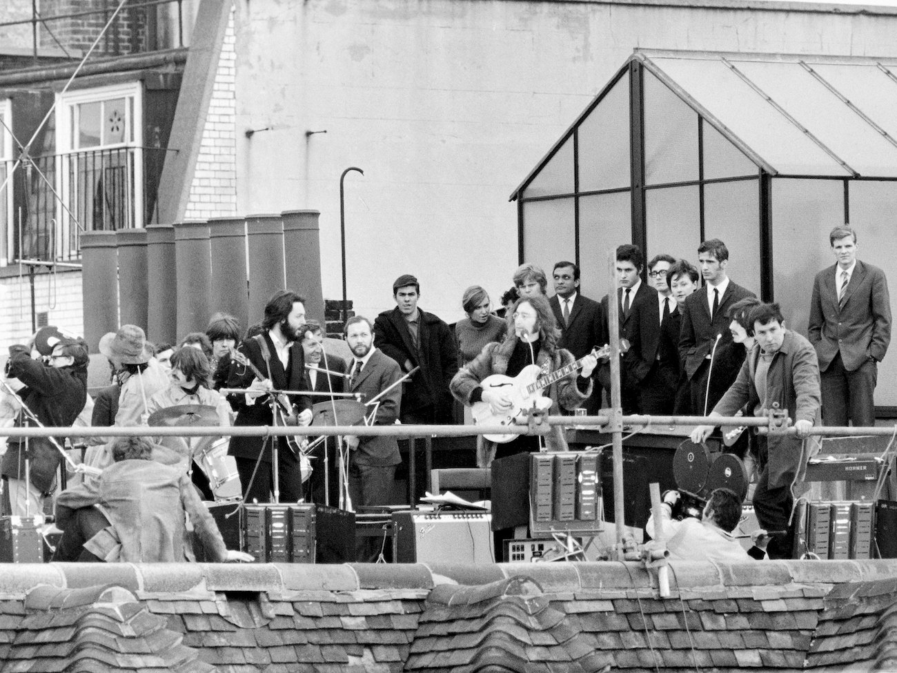 The Beatles performing on the rooftop of Apple headquarters, 1969.