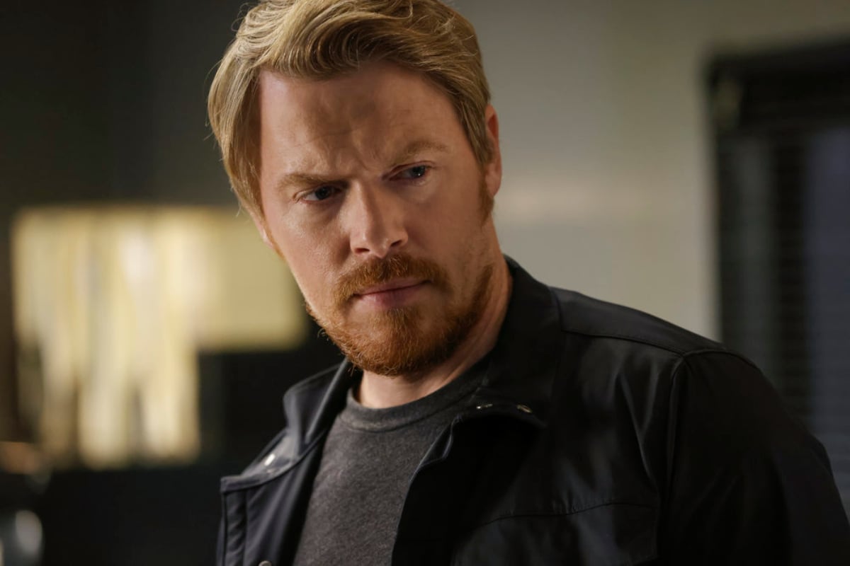 Diego Klattenhoff as Donald Ressler in 'The Blacklist' Season 9. Ressler has a full beard and is wearing a black leather jacket.