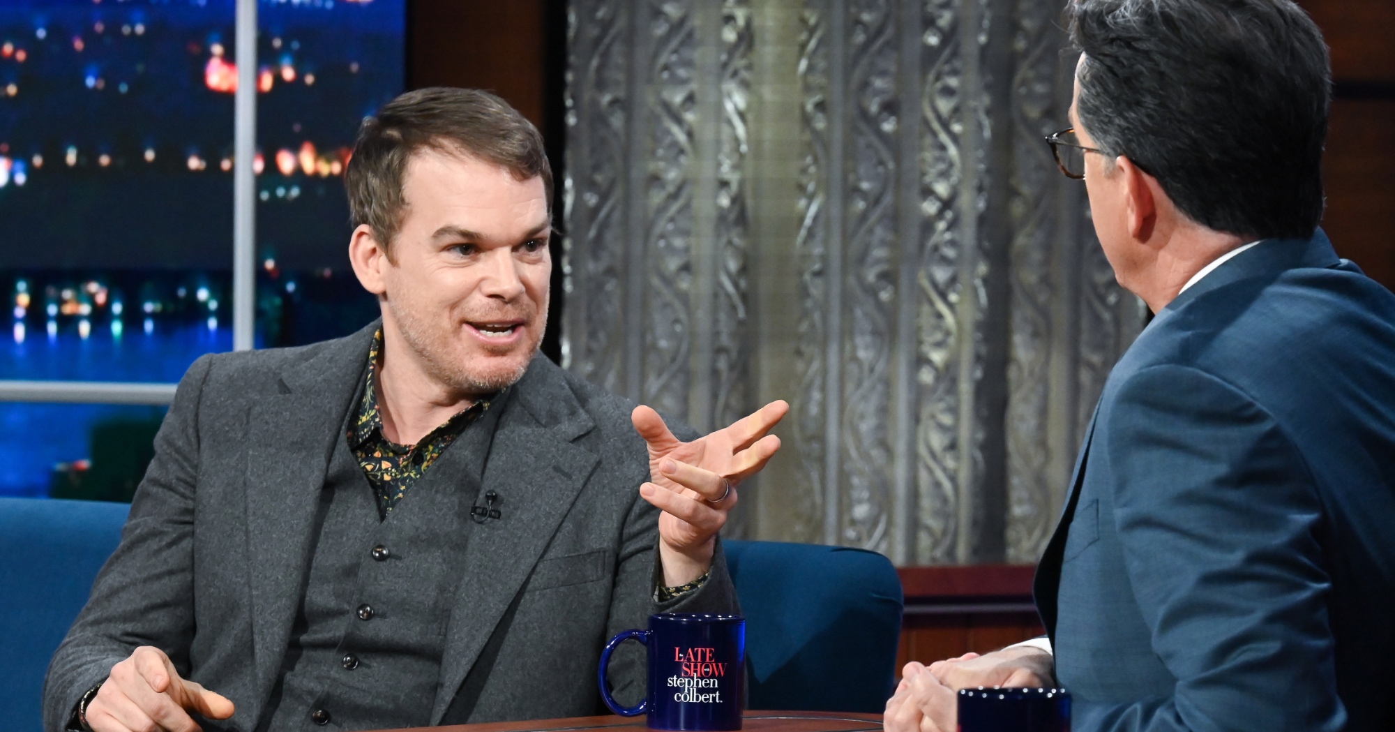 'The Late Show with Stephen Colbert' and guest Michael C. Hall from 'Dexter' wearing grey suit.