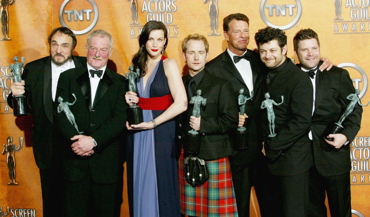 Actors John Rhys-Davies, Bernard Hill, Liv Tyler, Billy Boyd, John Noble, Andy Serkis, and Sean Astin pose with their awards for Outstanding Performance by a Cast in a Motion Picture for 'Lord of the Rings: The Return of the King' during the 2004 SAG Awards