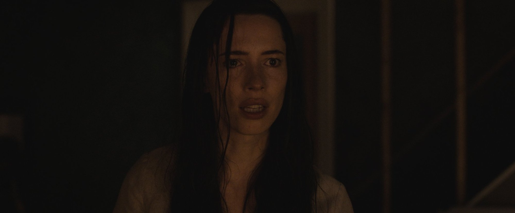 'The Night House' Rebecca Hall as Beth looking frightened with tears in her eyes