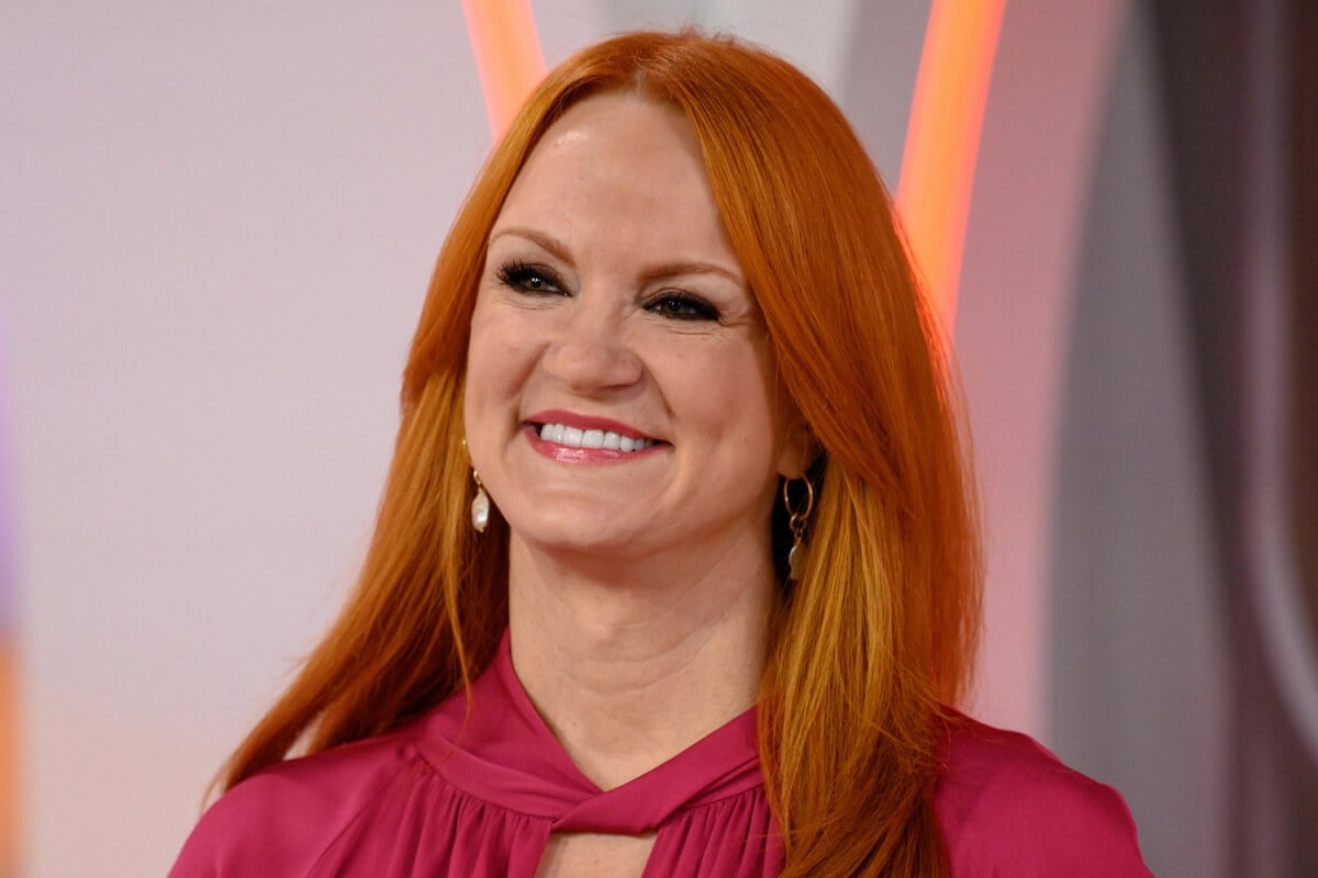 The Pioneer Woman Ree Drummond smiles and wears a pink top.