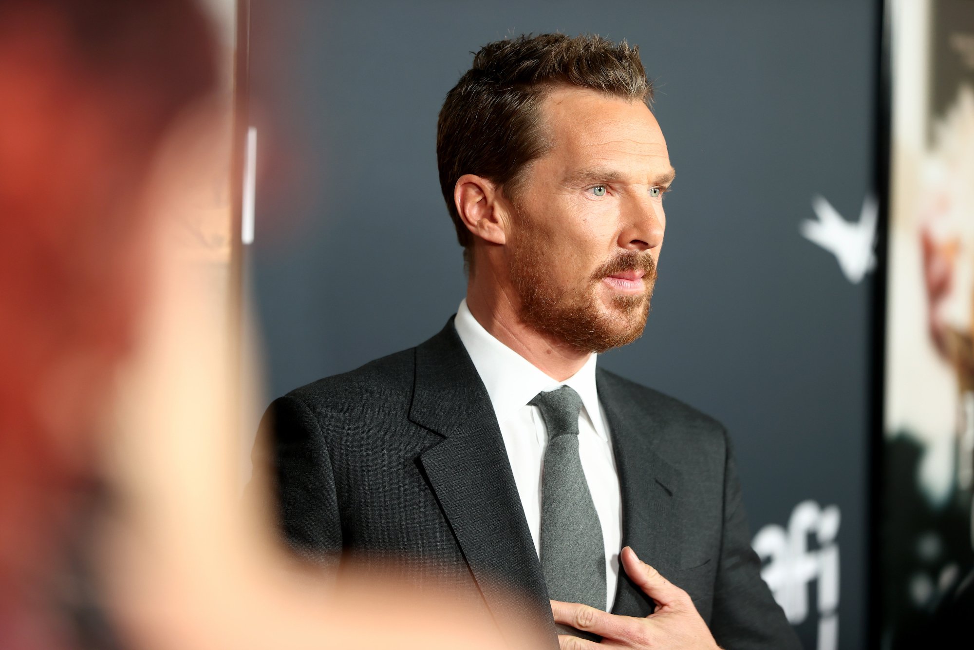 'The Power of the Dog' actor Benedict Cumberbatch wearing a suit in front of an AFI step and repeat