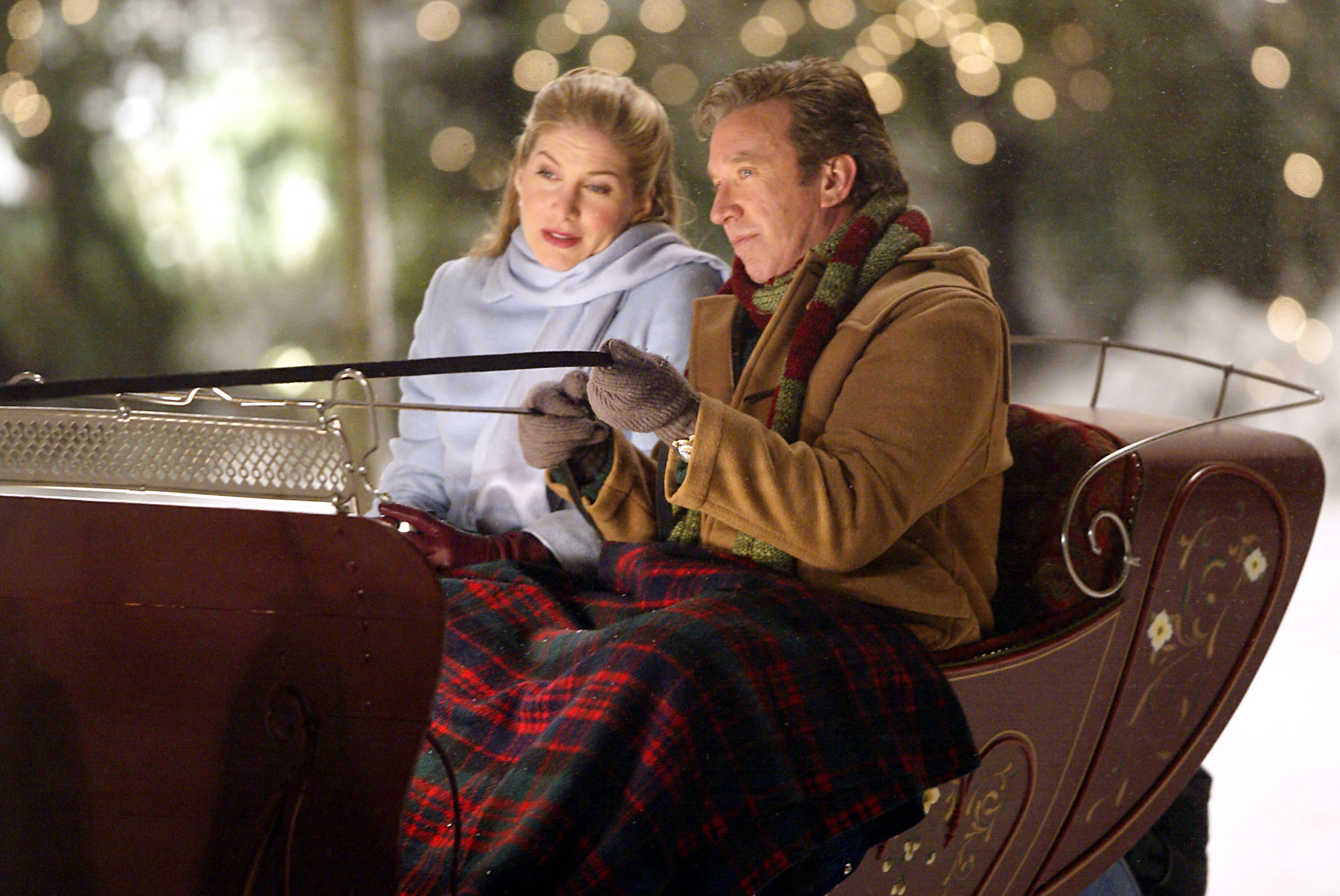 'The Santa Clause 2' Elizabeth Mitchell as Carol and Tim Allen as Scott Calvin, Santa sitting in Santa's sleigh