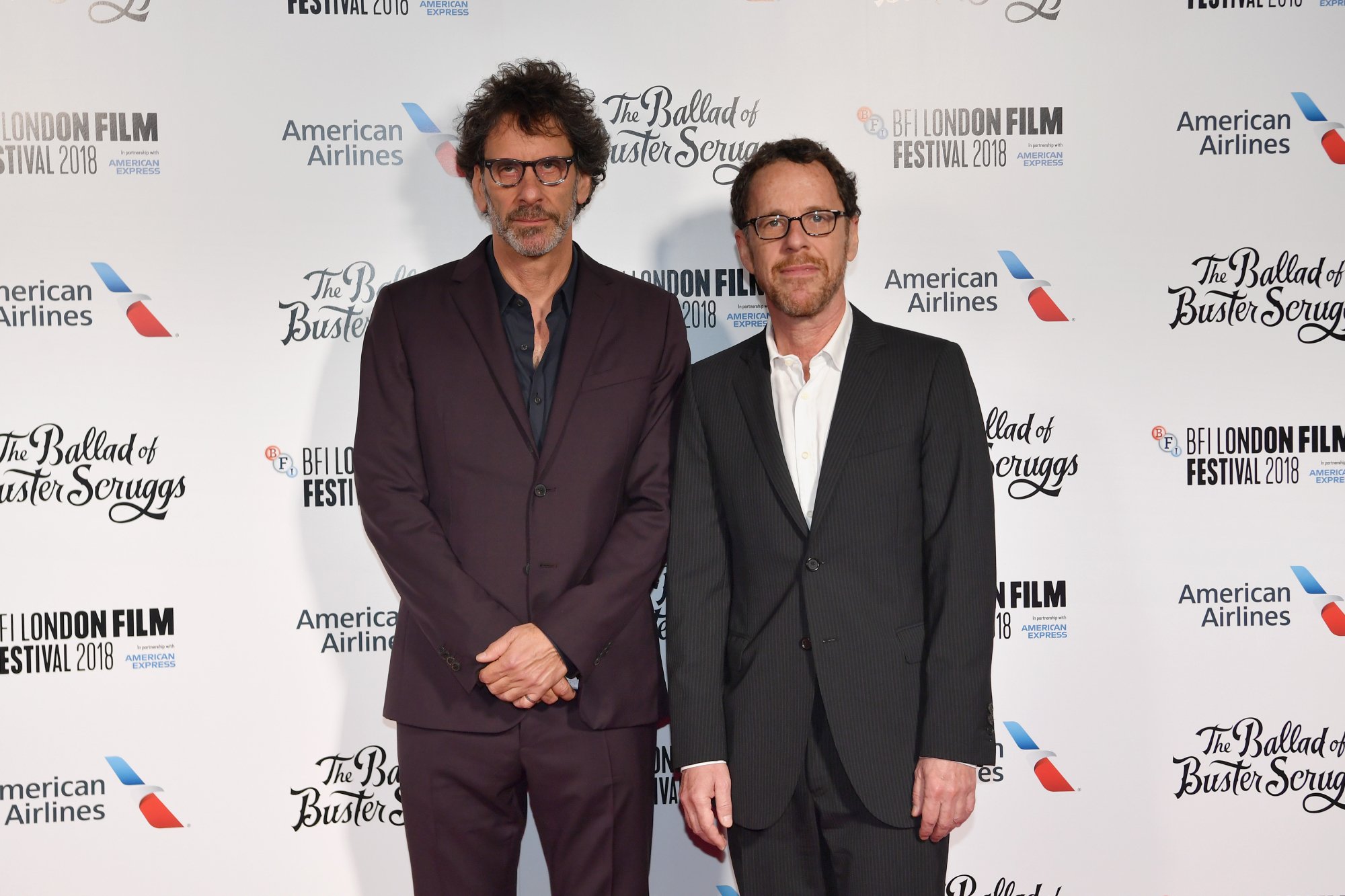 'The Tragedy of Macbeth' filmmaker Joel Coen and his brother Ethan Coen standing in front of a white step and repeat