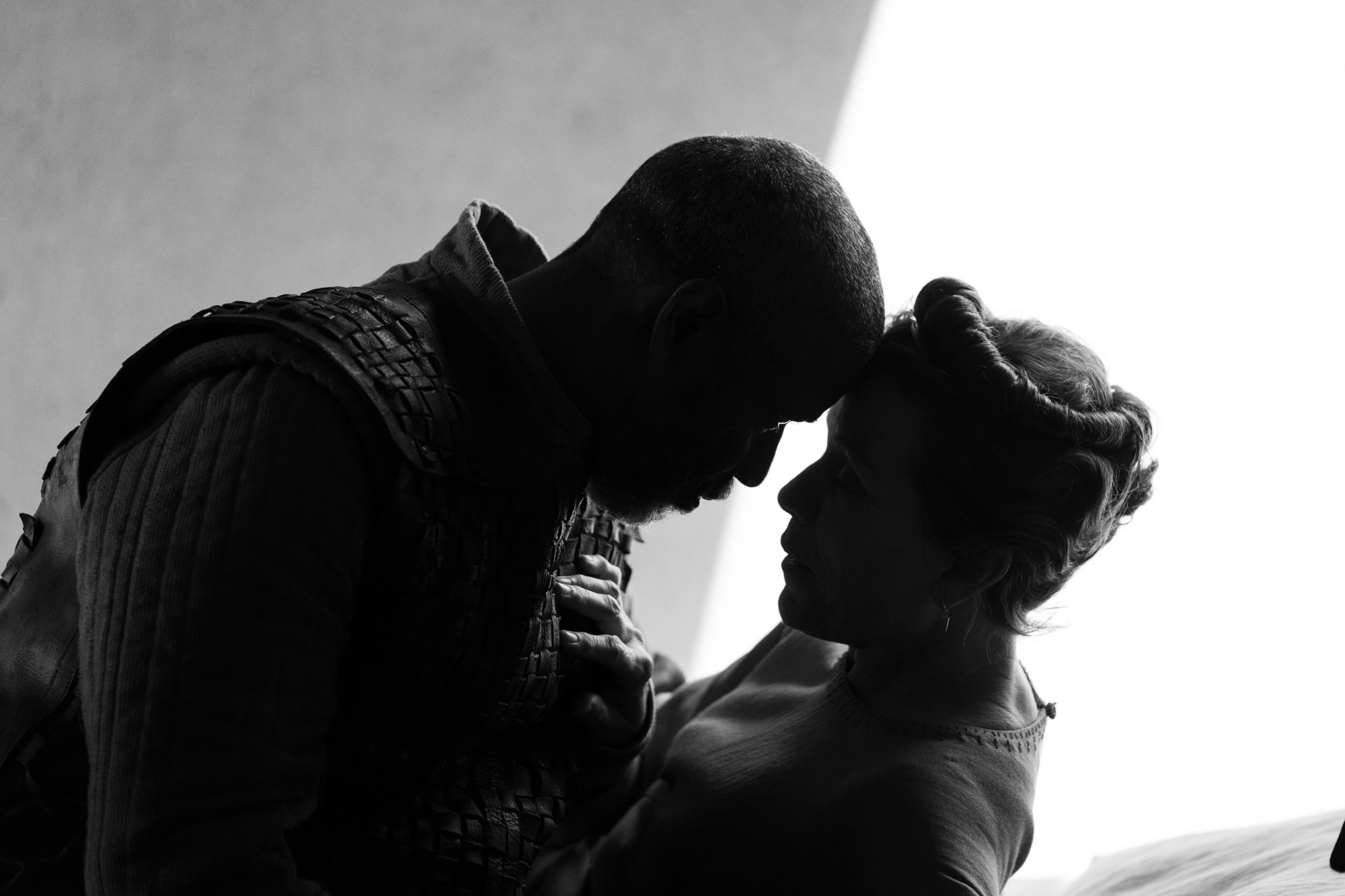 'The Tragedy of Macbeth' review Denzel Washington as Macbeth and Frances McDormand as Lady Macbeth touching their foreheads against each other's