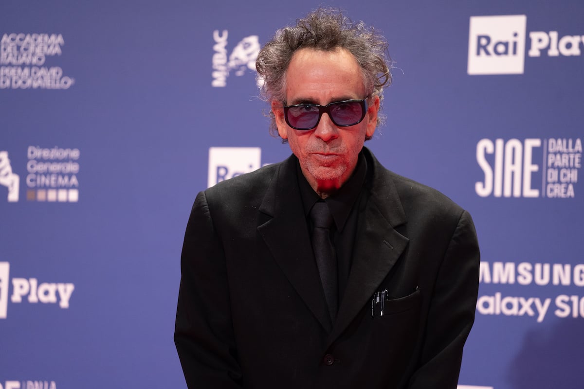 Tim Burton walks a red carpet in 2019