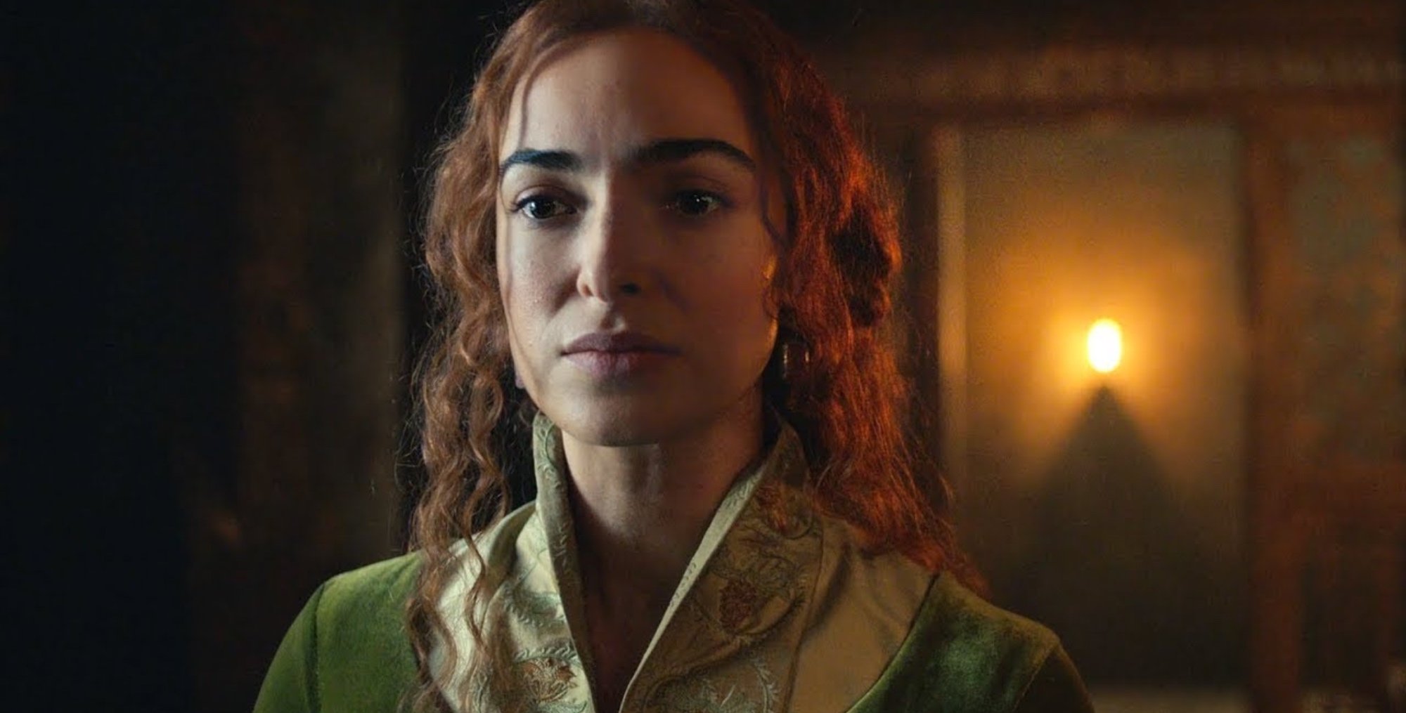 Triss in 'The Witcher' Season 2 episode 4 love triangle wearing green dress.