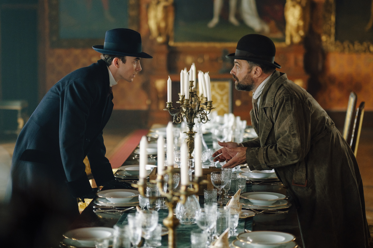 Max and Oskar looking at each other across a table in 'Vienna Blood' Season 2