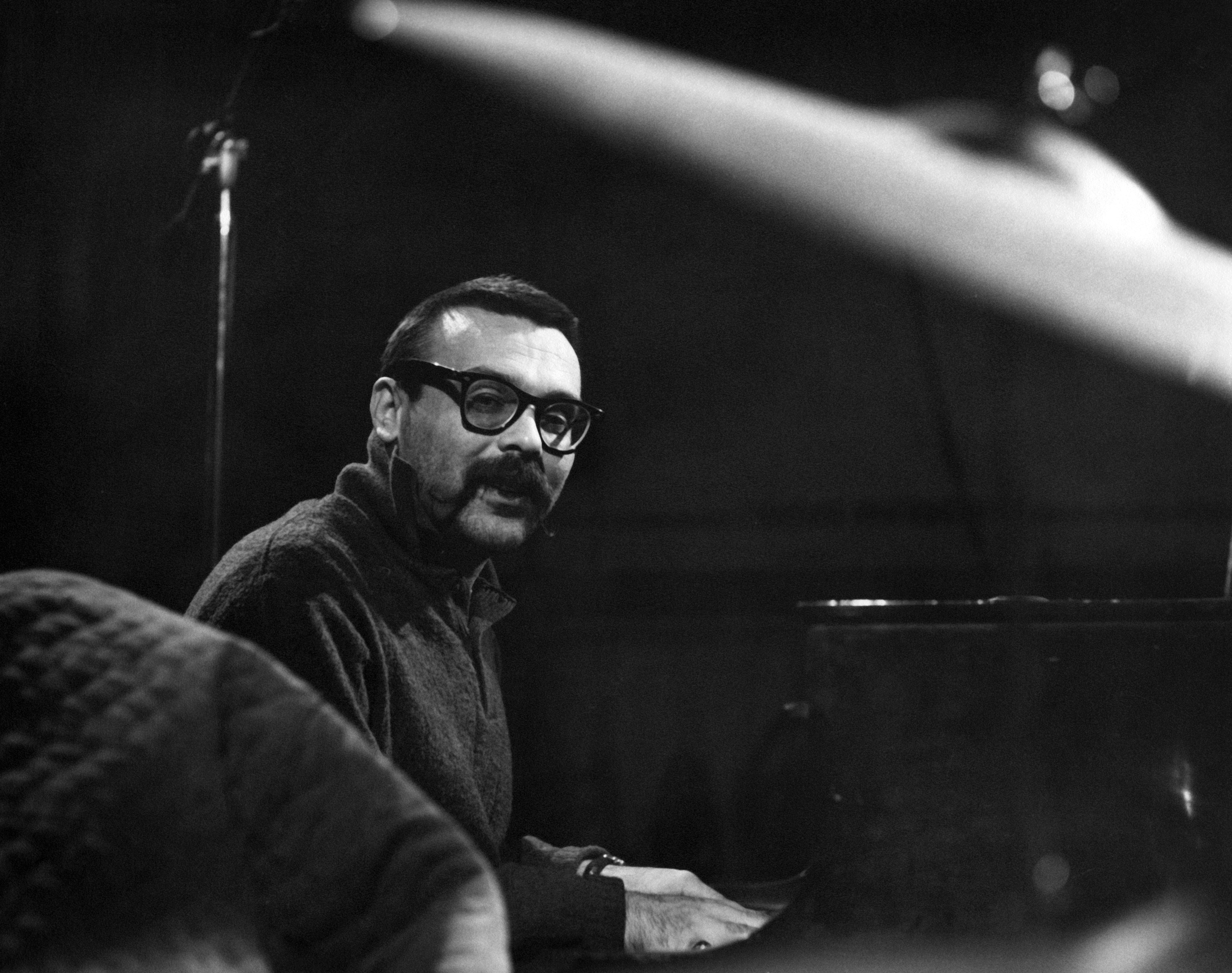 Black and white photo of Vince Guaraldi at the piano