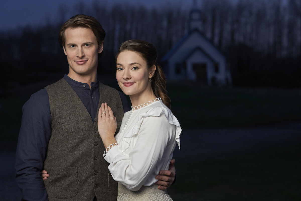 Jesse (Aren Buchholz) with his arm around Clara (Eva Bourne) in 'When Calls the Heart' Season 7