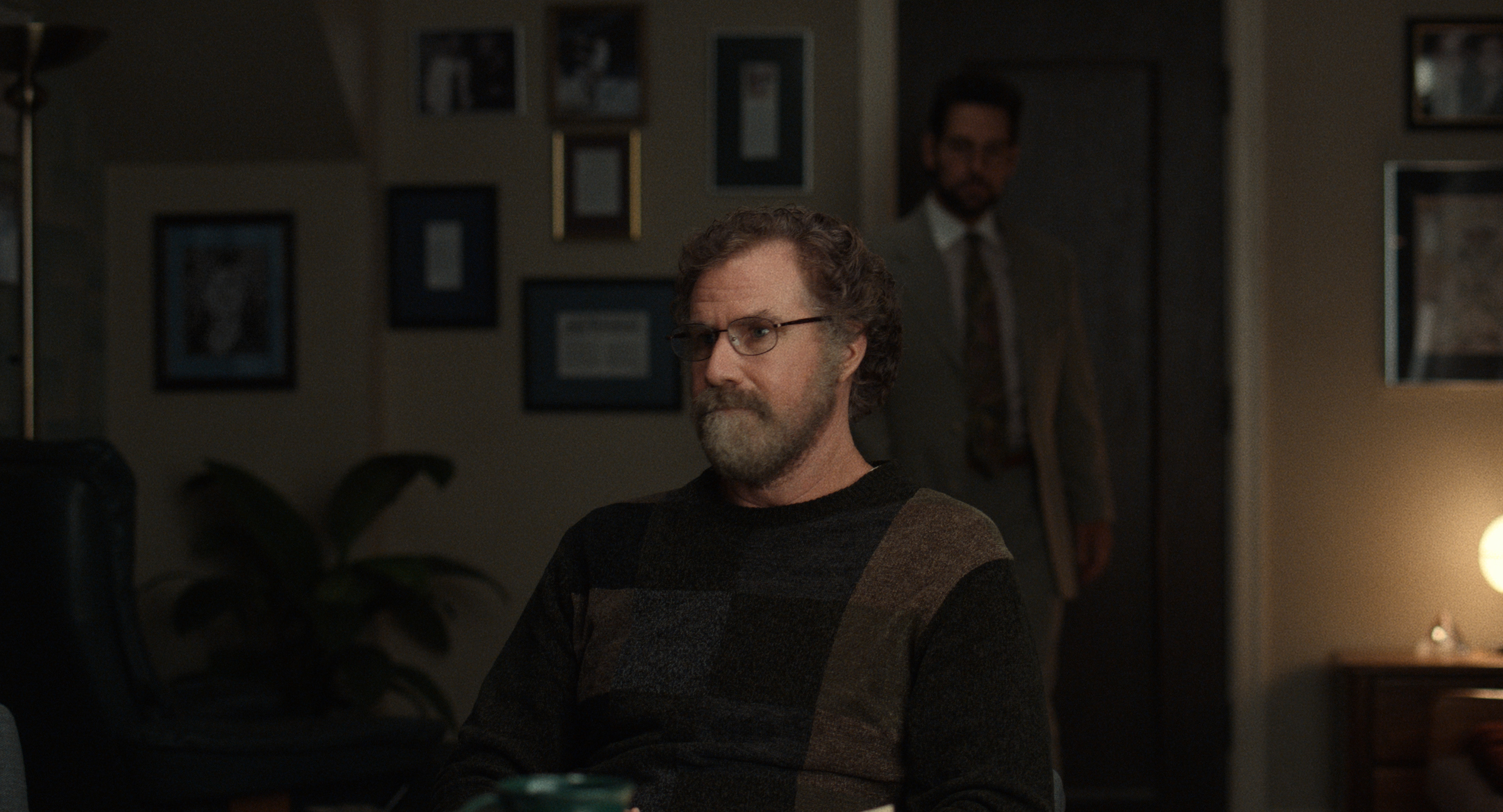 Will Ferrell as Marty Markowitz with Paul Rudd as Ike Herschkopf standing behind him in 'The Shrink Next Door'