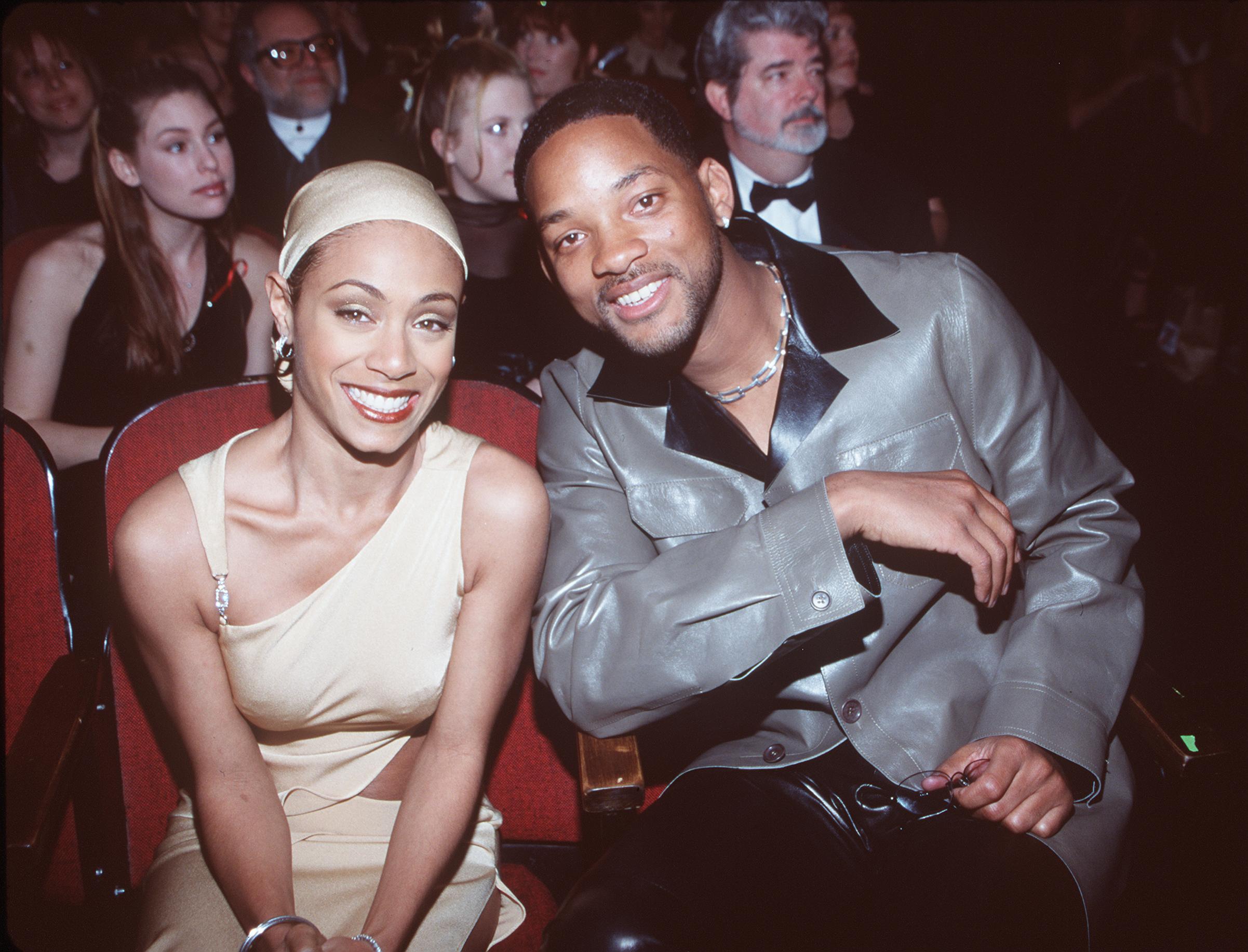 Will Smith and Jada Pinkett Smith sit together at the 1999 Grammy Awards