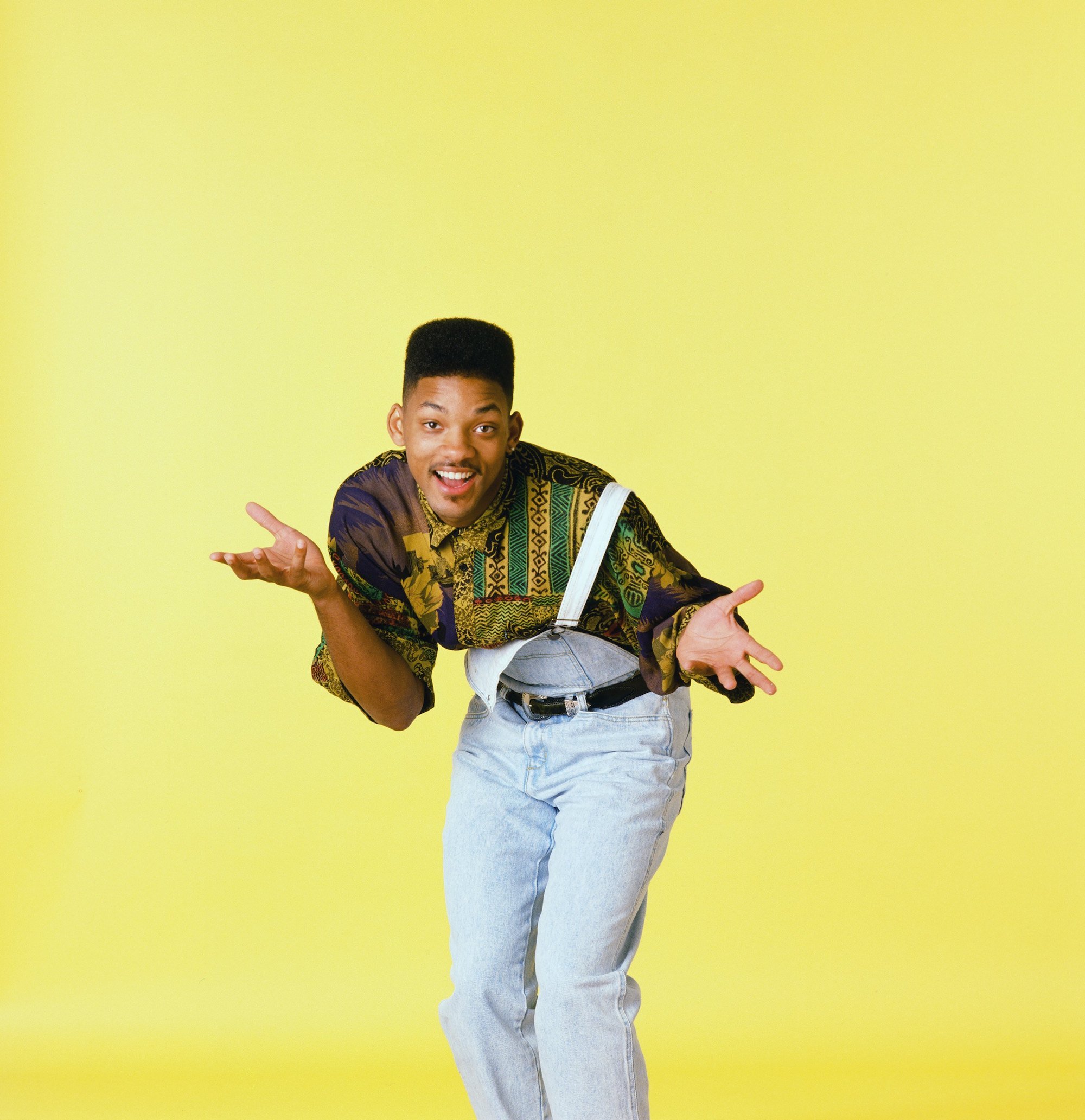Will Smith shrugs with his overalls open