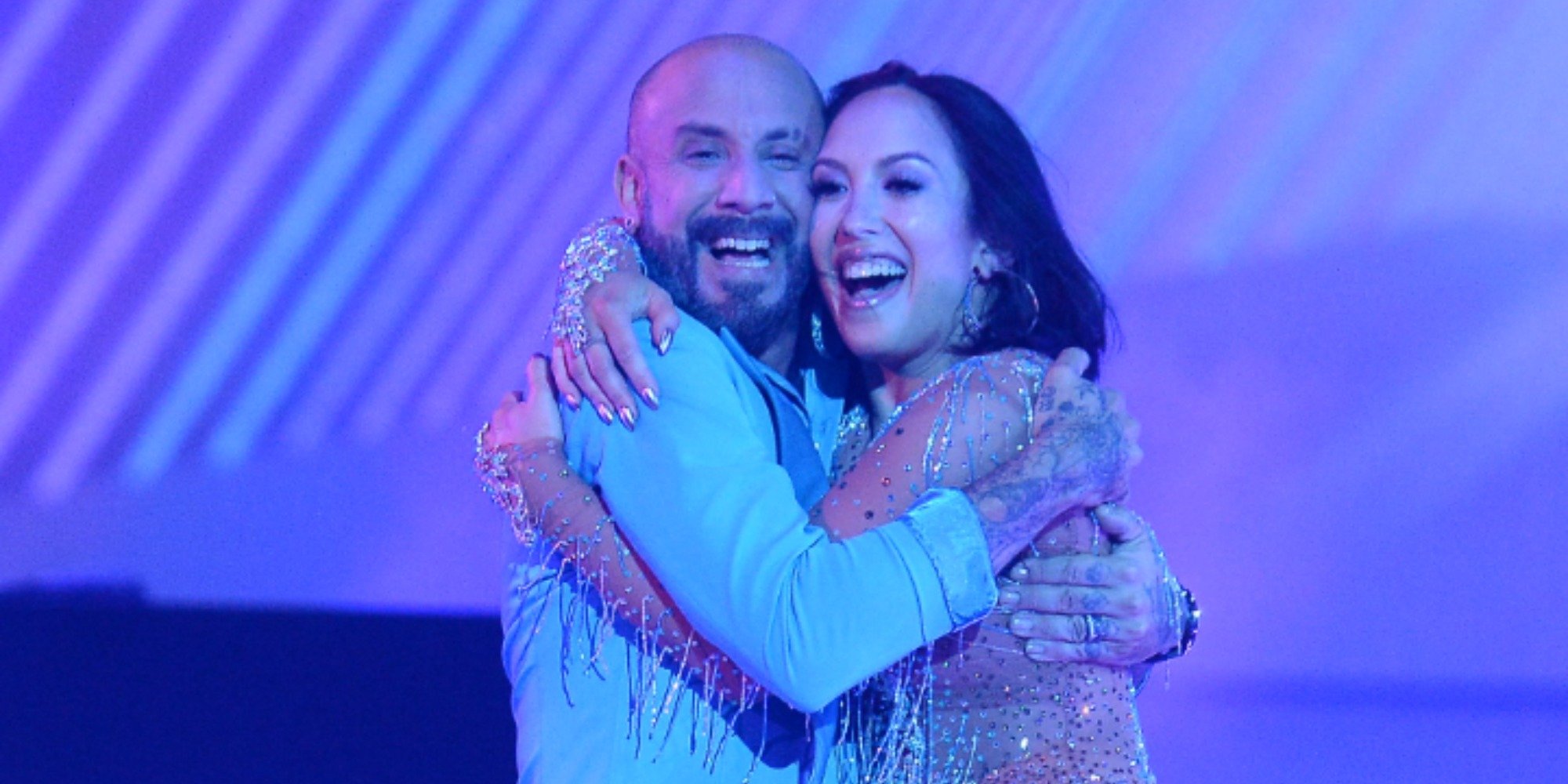 AJ McLean and Cheryl Burke hug one another on the set of Dancing with the Stars.