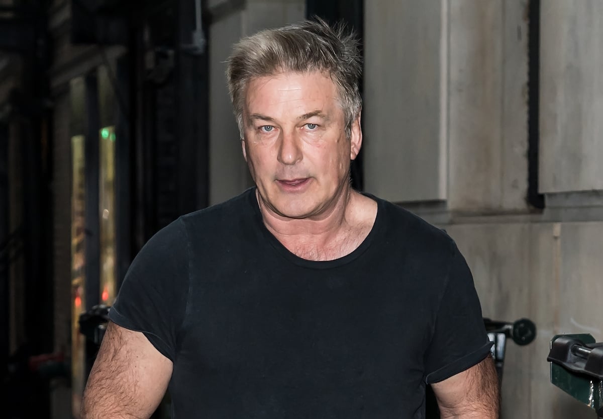 Alec Baldwin, who accidentally shot Halyna Hutchins, in a dark shirt walking