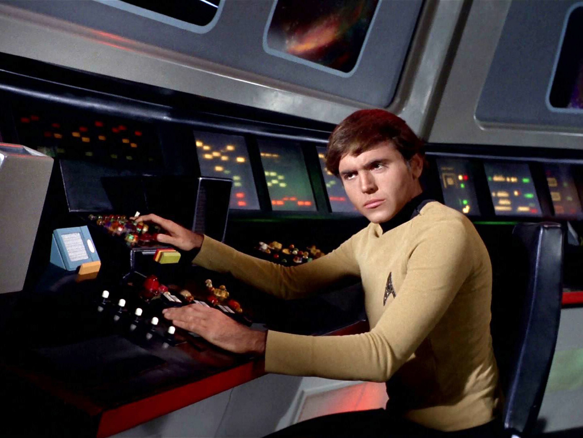 Pavel Chekov sitting in his chair in 'Star Trek: The Original Series'