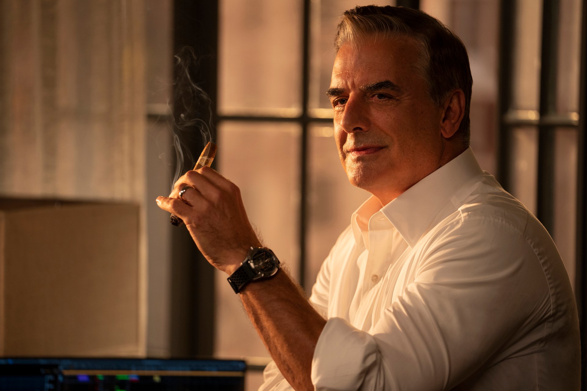 Chris Noth smokes a cigar bofore Mr. Big's death in episode 1 of 'And Just Like That...', the 'Sex and the City' reboot