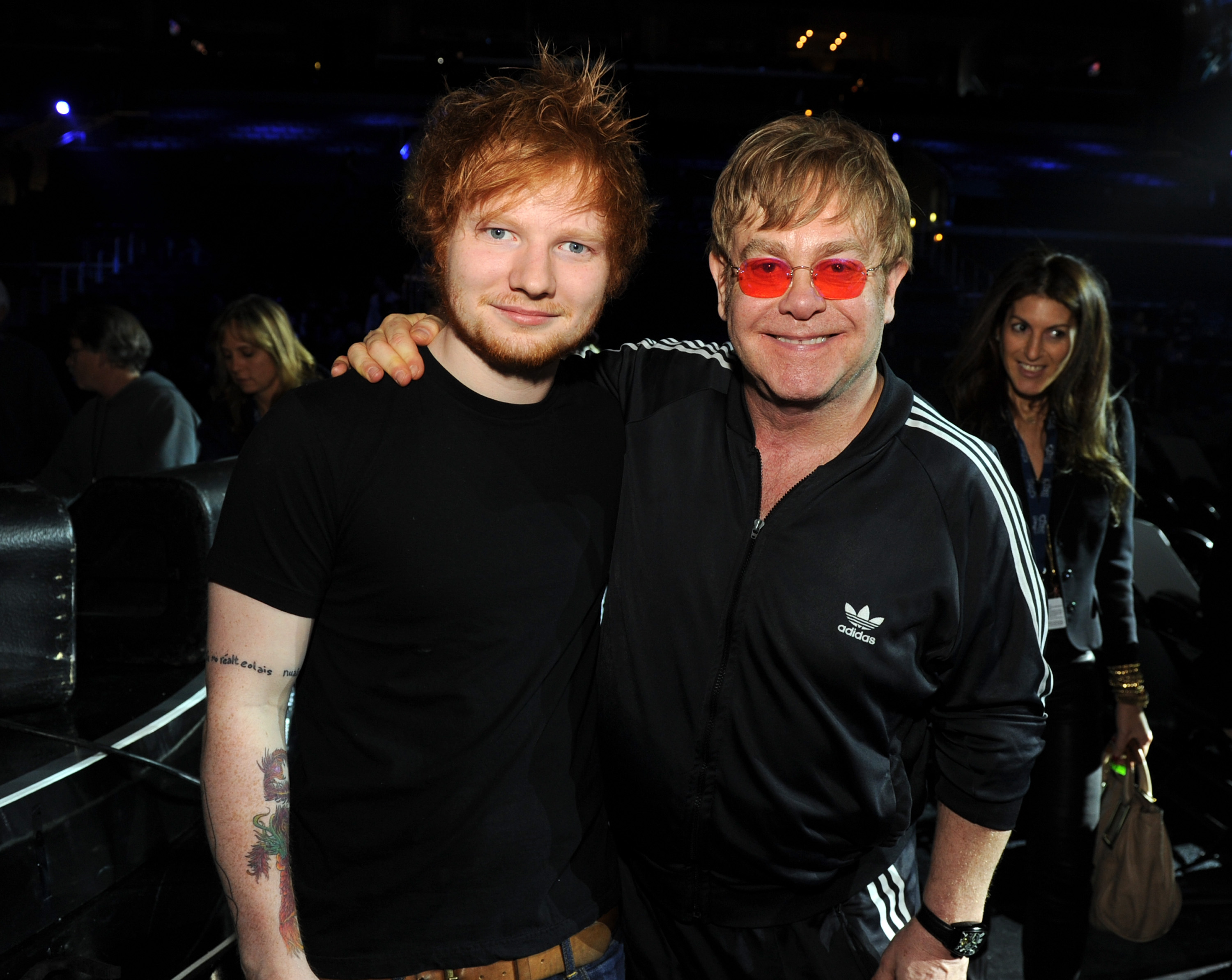 Elton John putting his arm around Ed Sheeran