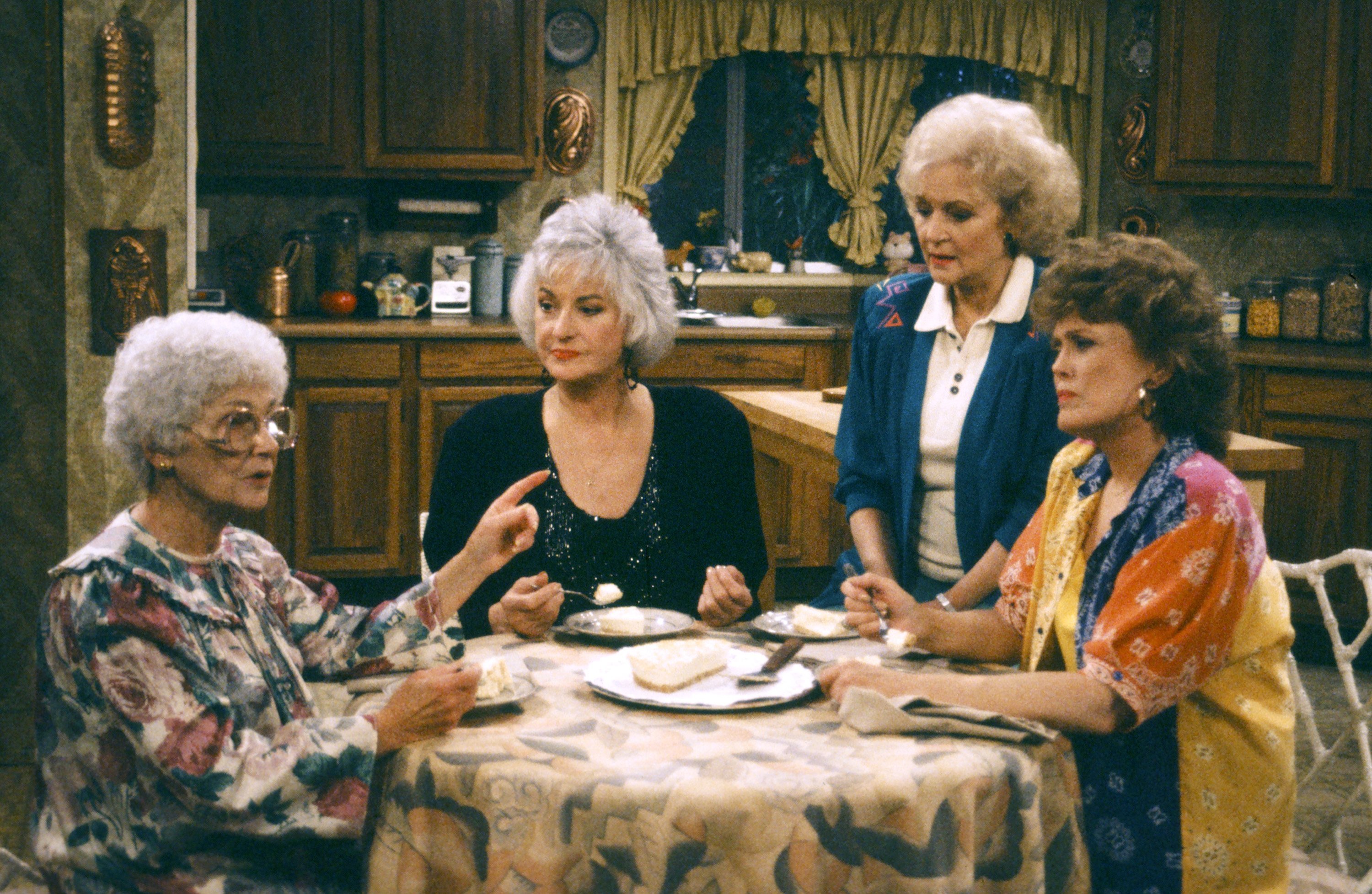 Sophia, Dorothy, Rose and Blanche sit in their kitchen during an episode of 'The Golden Girls'