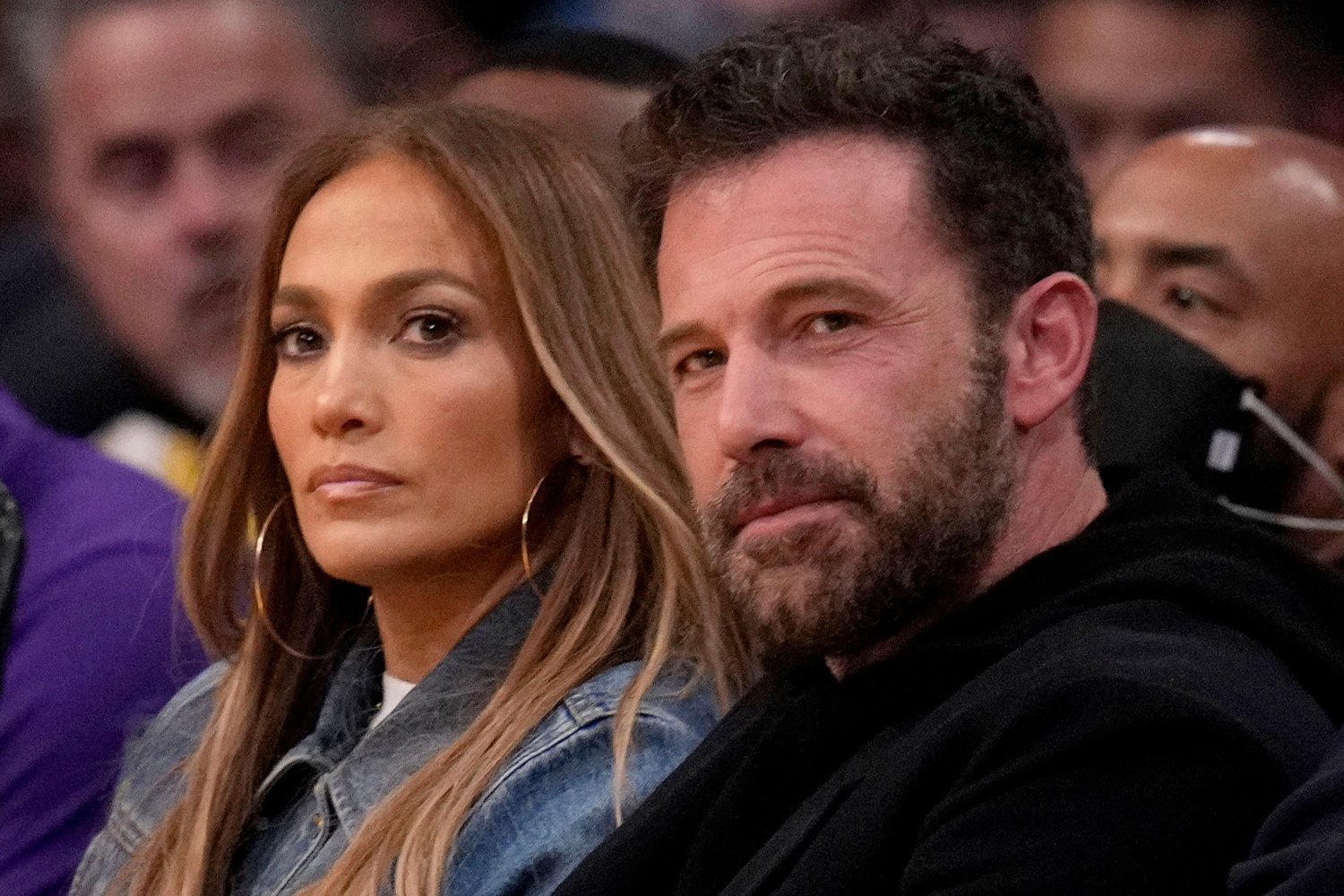 Jennifer looking serious, Ben Affleck smiling