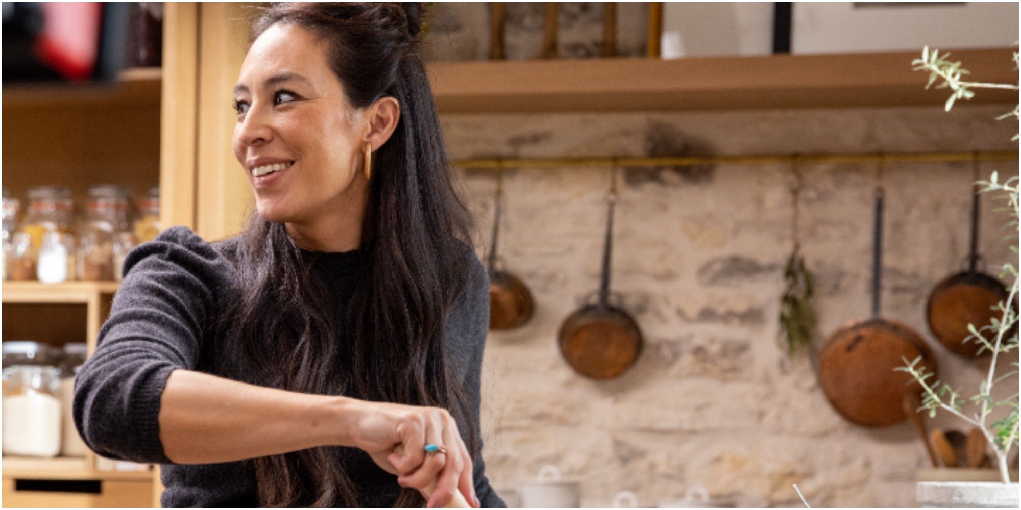 Joanna Gaines looks away from the camera on the set of her cooking show.
