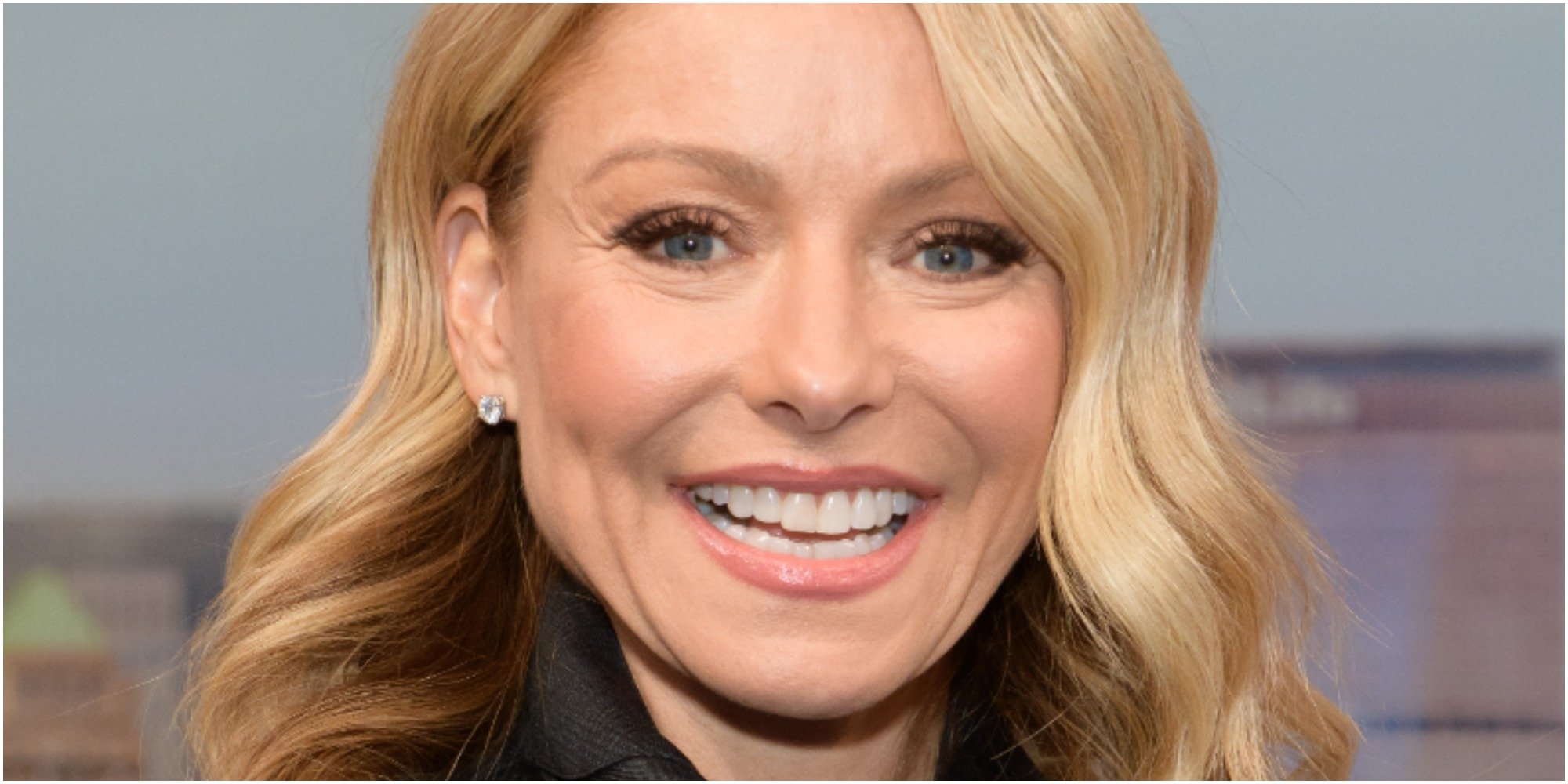 Kelly Ripa poses at a red carpet event.