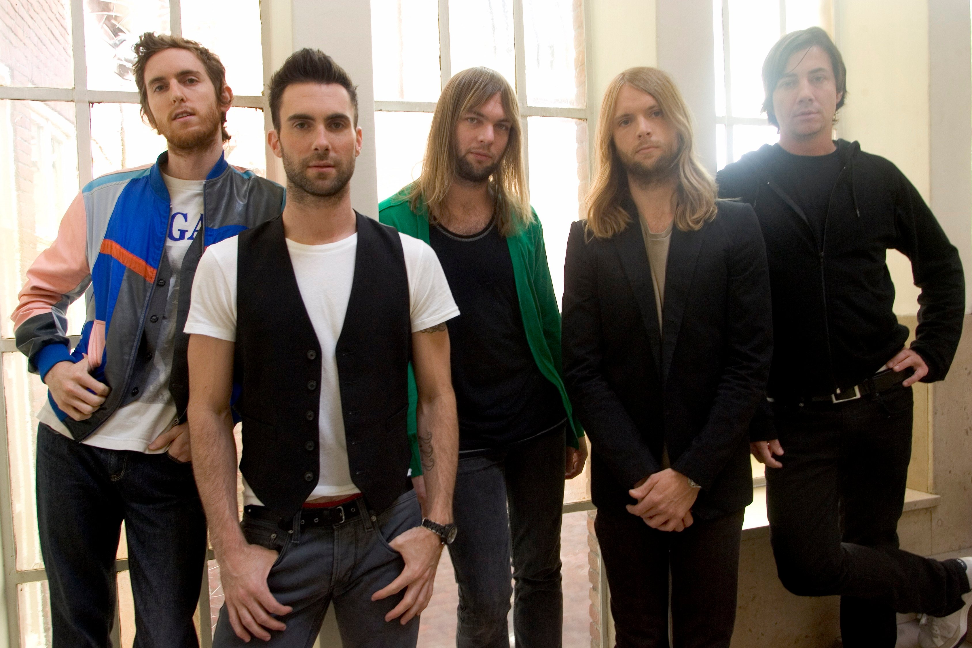 Maroon 5's Jesse Carmichael, Adam Levine, Mickey Madden, James Valentine, and Matt Flynn standing in a row