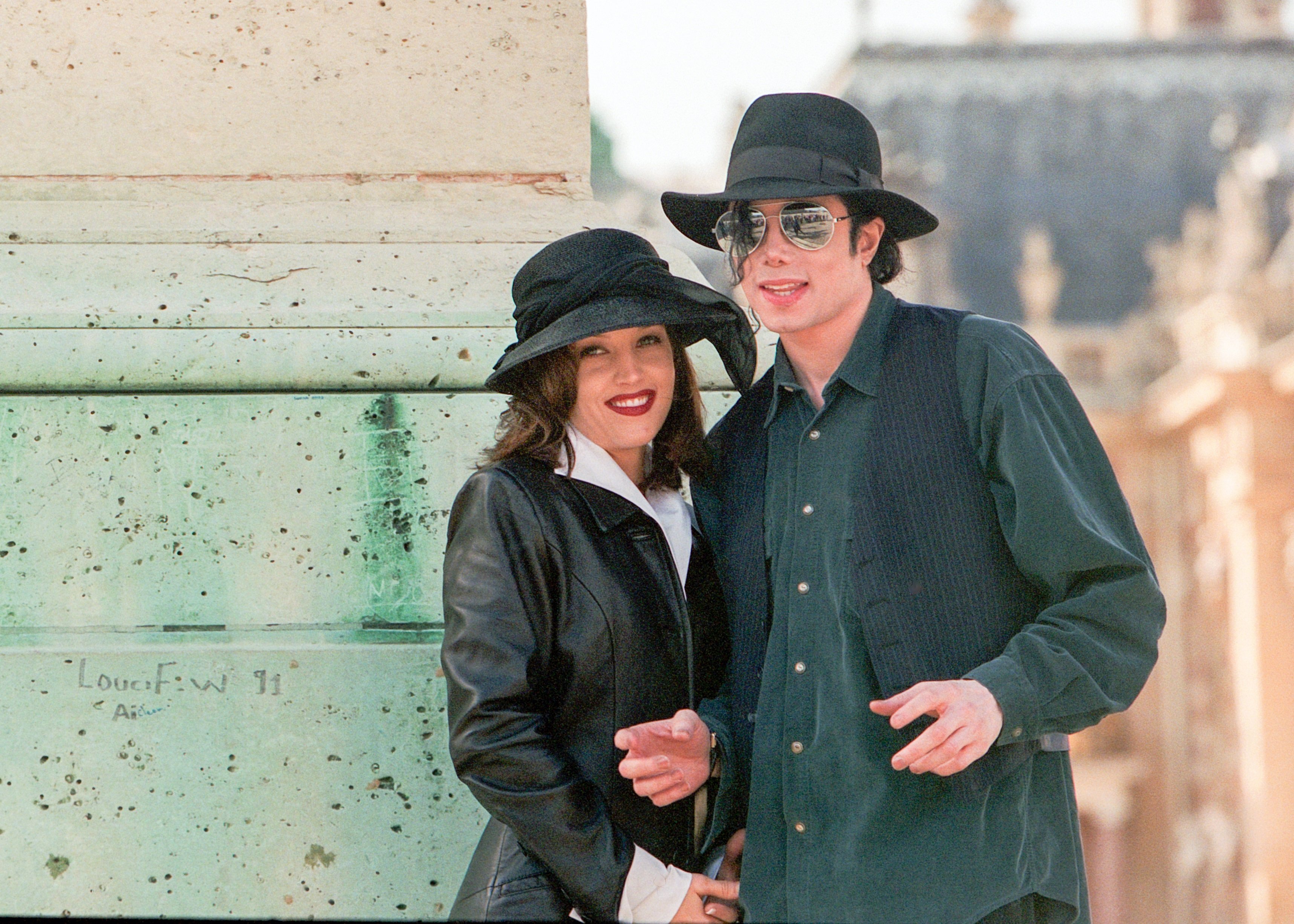 Elvis Presley's daughter, Lisa Marie Presley, and Michael Jackson wearing black clothes