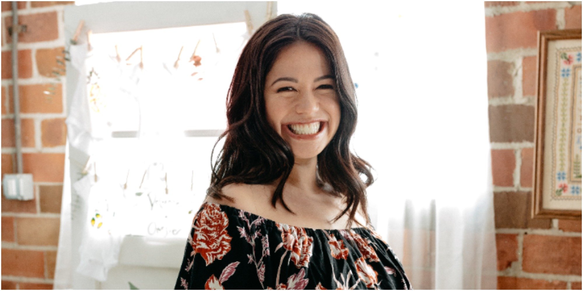 Molly Yeh poses in a floral dress for a publicity photograph.