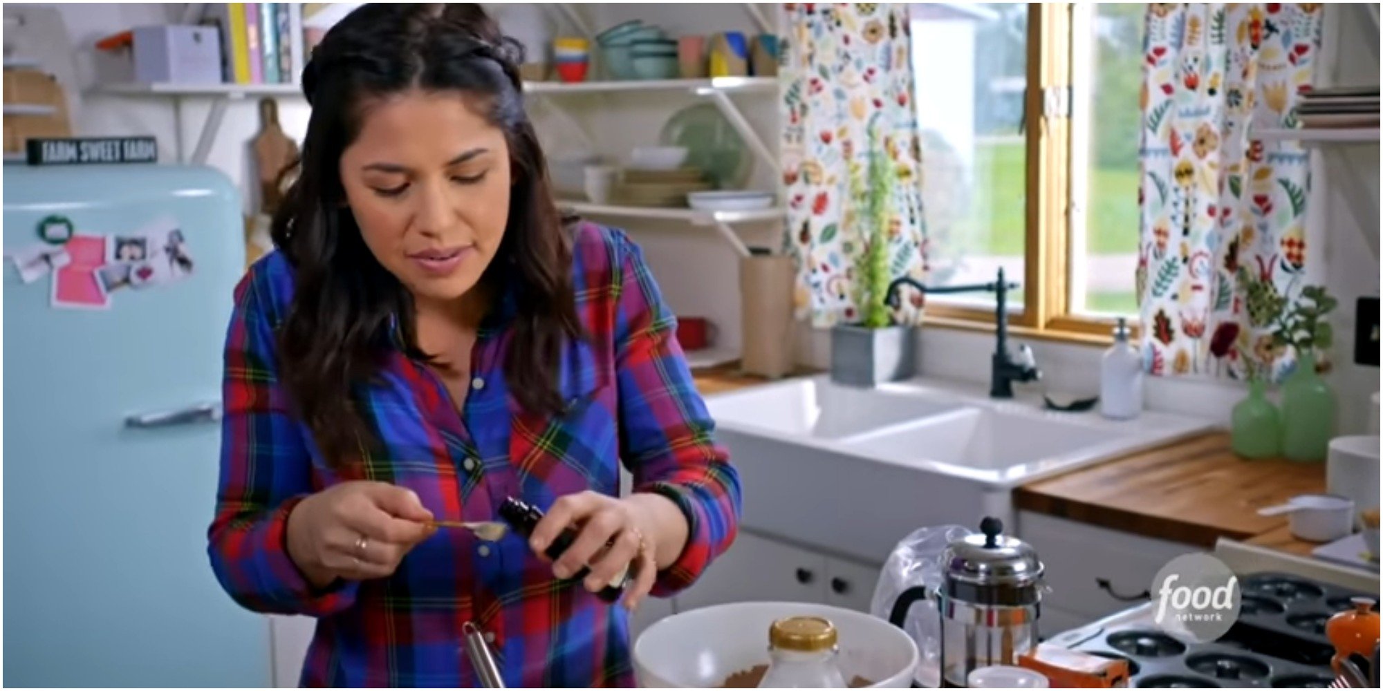 Molly Yeh makes chocolate donuts with coffee glaze in a screenshot.