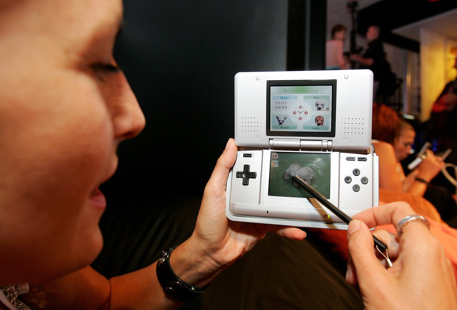 Model Daniela Schaar plays Nintendogs on Nintendo DS