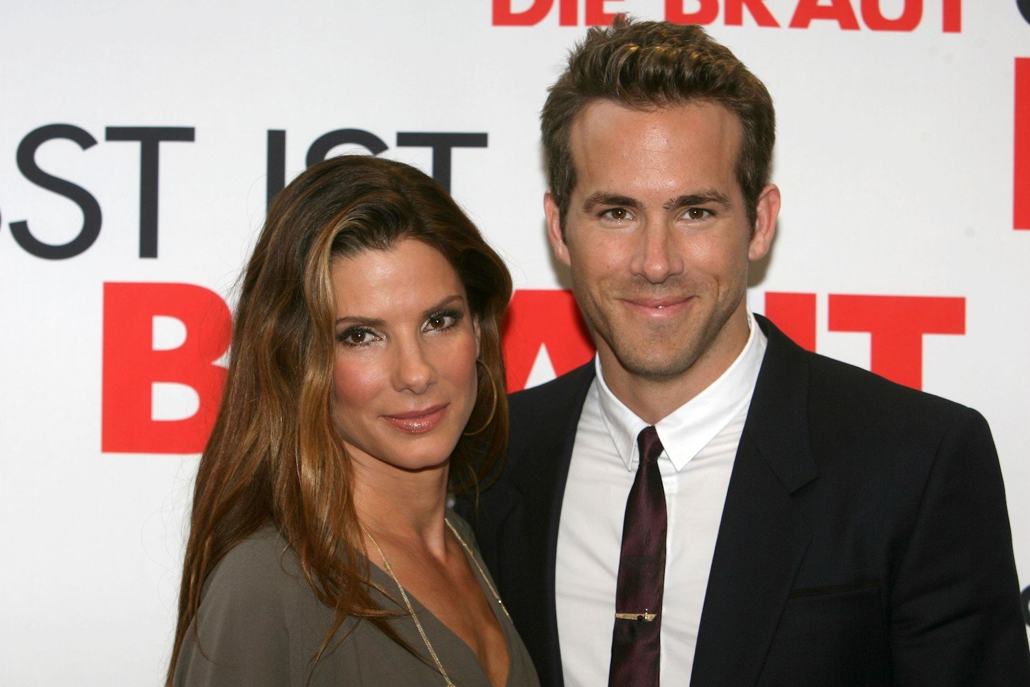 Sandra Bullock and Ryan Reynolds smile on the red carpet at the premiere of 'The Proposal' 