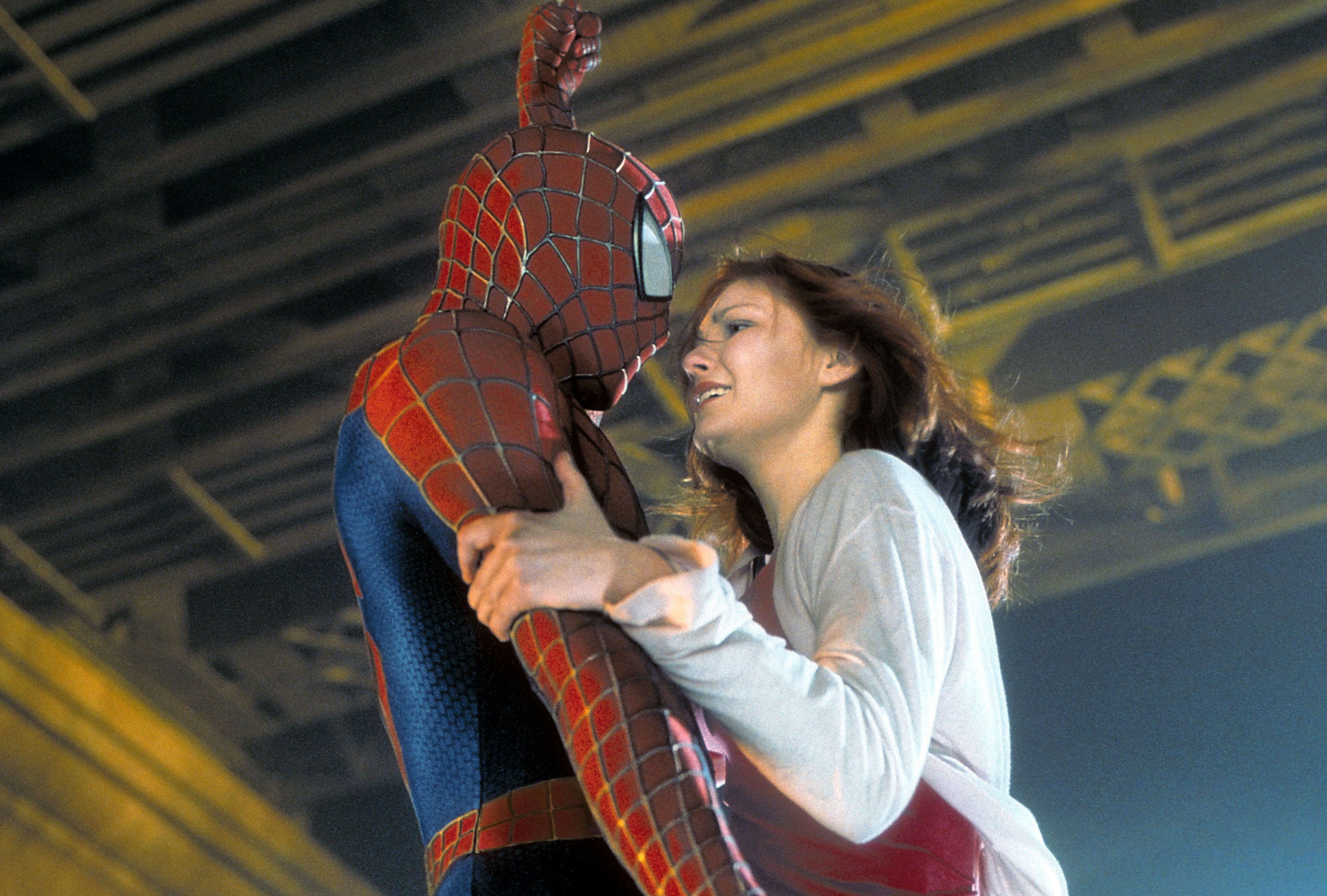 Spider-Man holding Mary Jane Watson