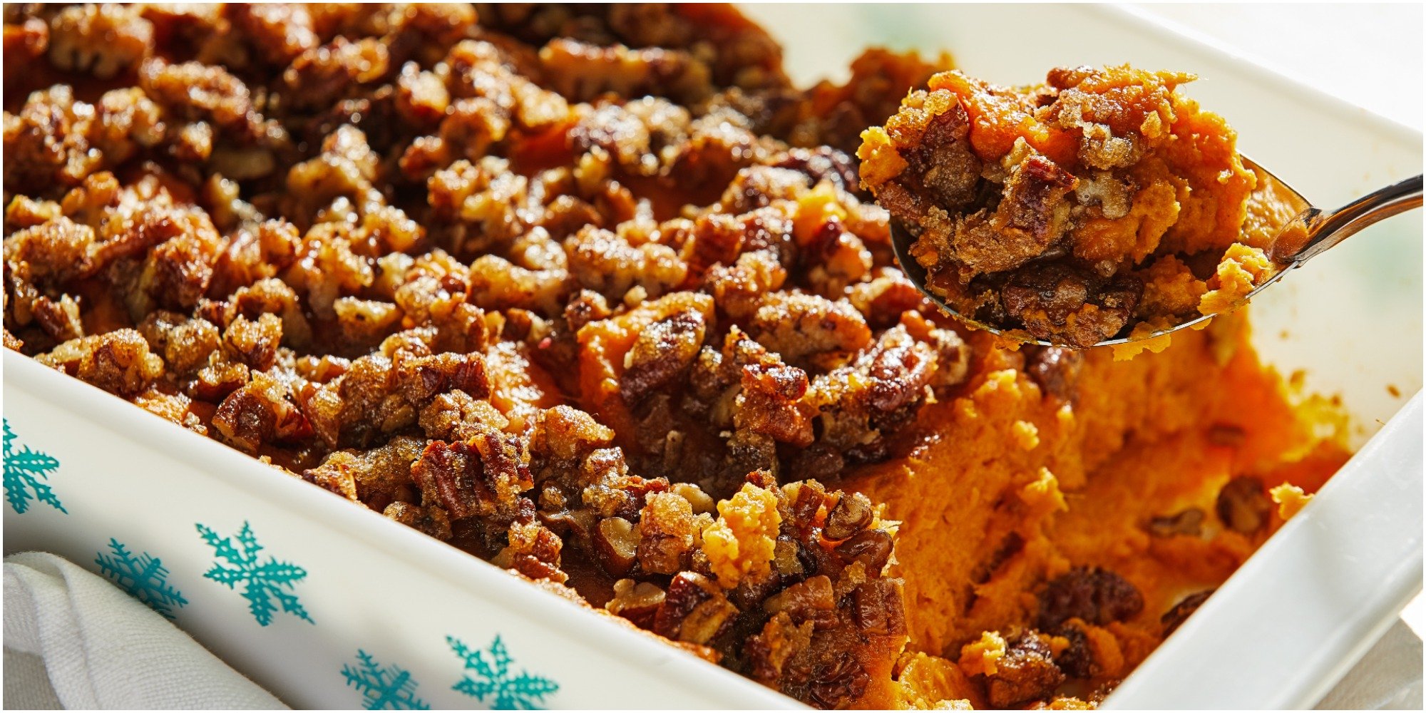 Sweet potato casserole in a white and blue pan.