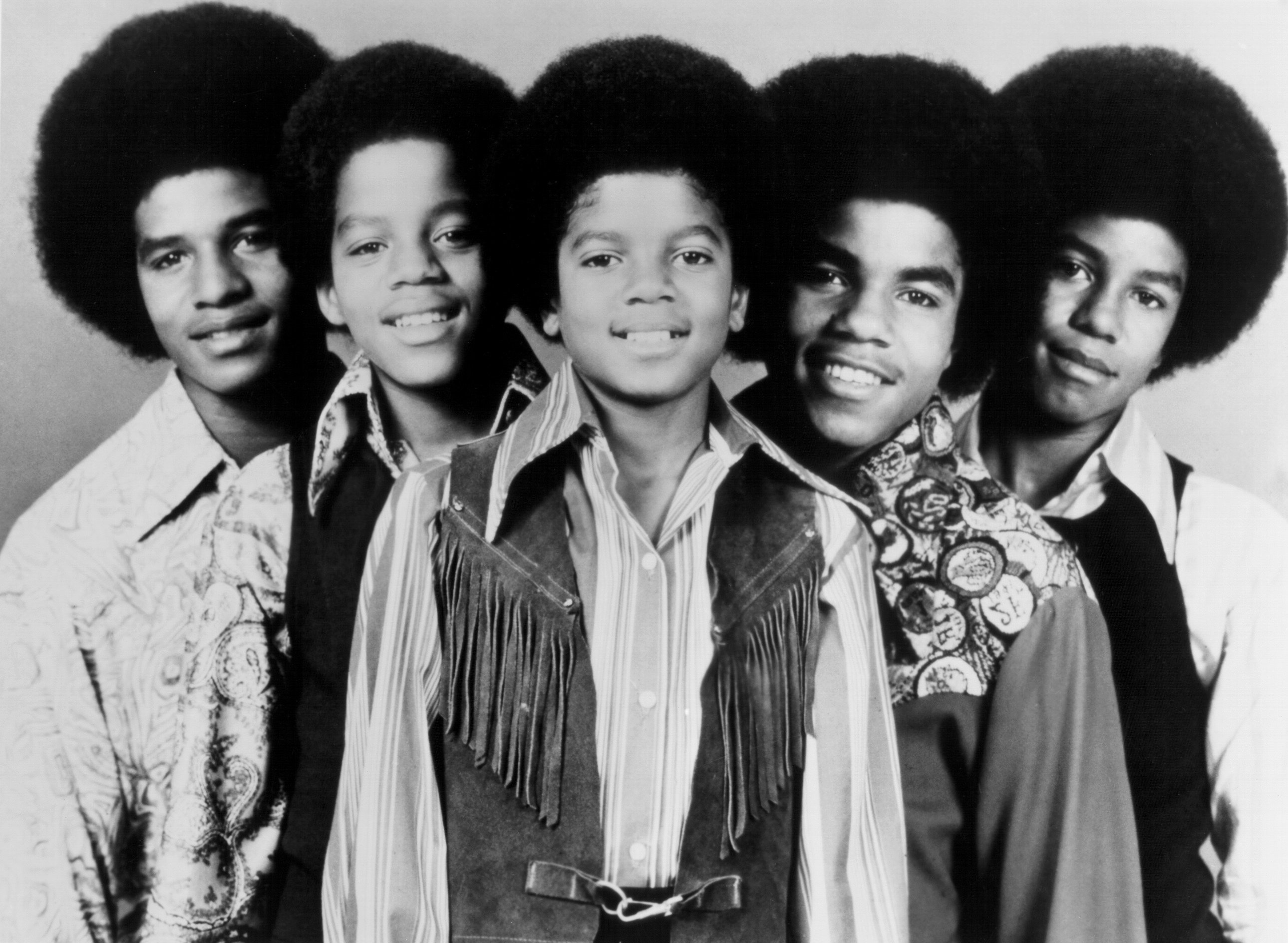 The Jackson 5's Tito Jackson, Marlon Jackson, Michael Jackson, Jackie Jackson, and Jermaine Jackson standing in a row