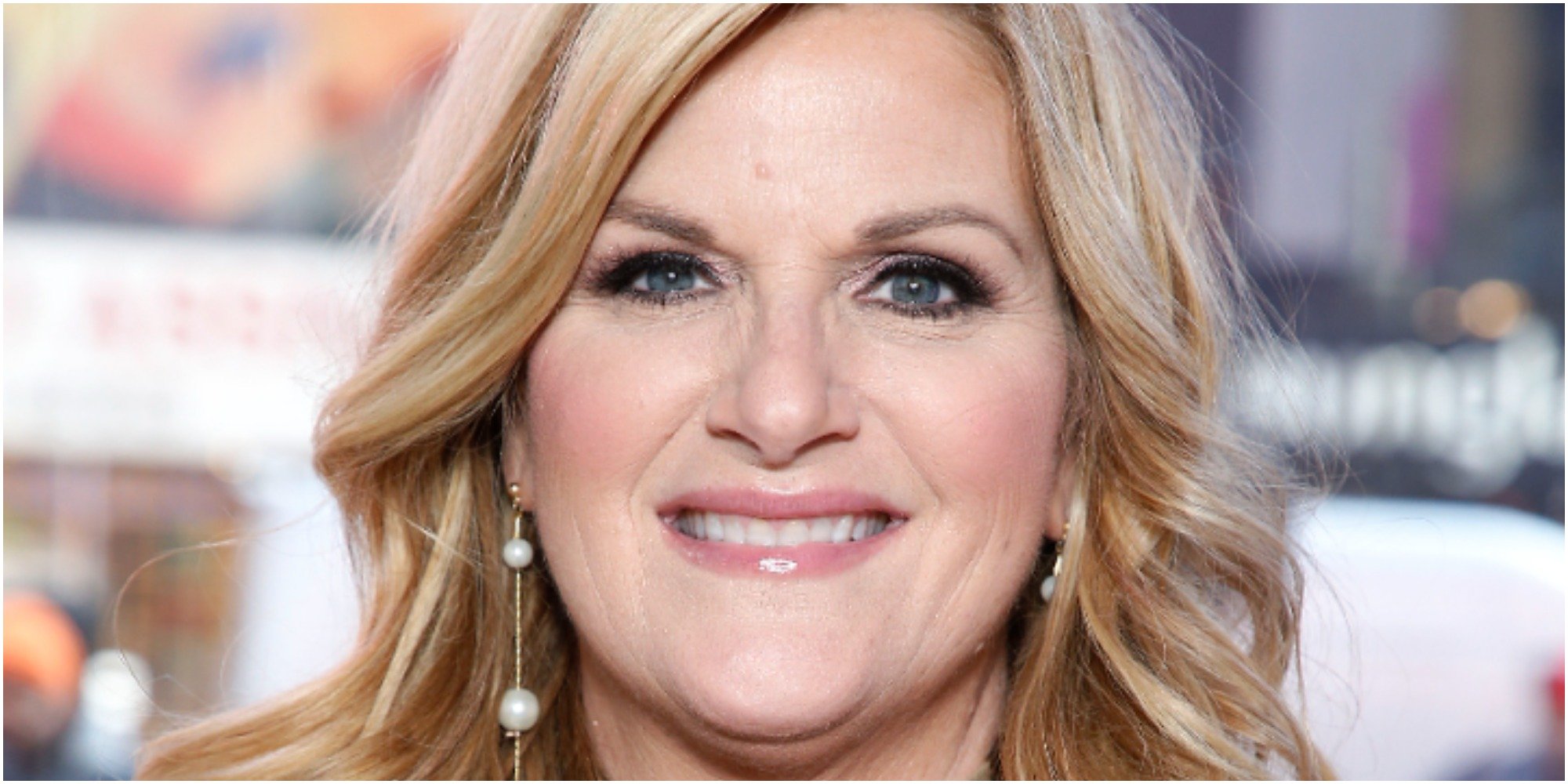 Trisha Yearwood poses on the red carpet at a press event.