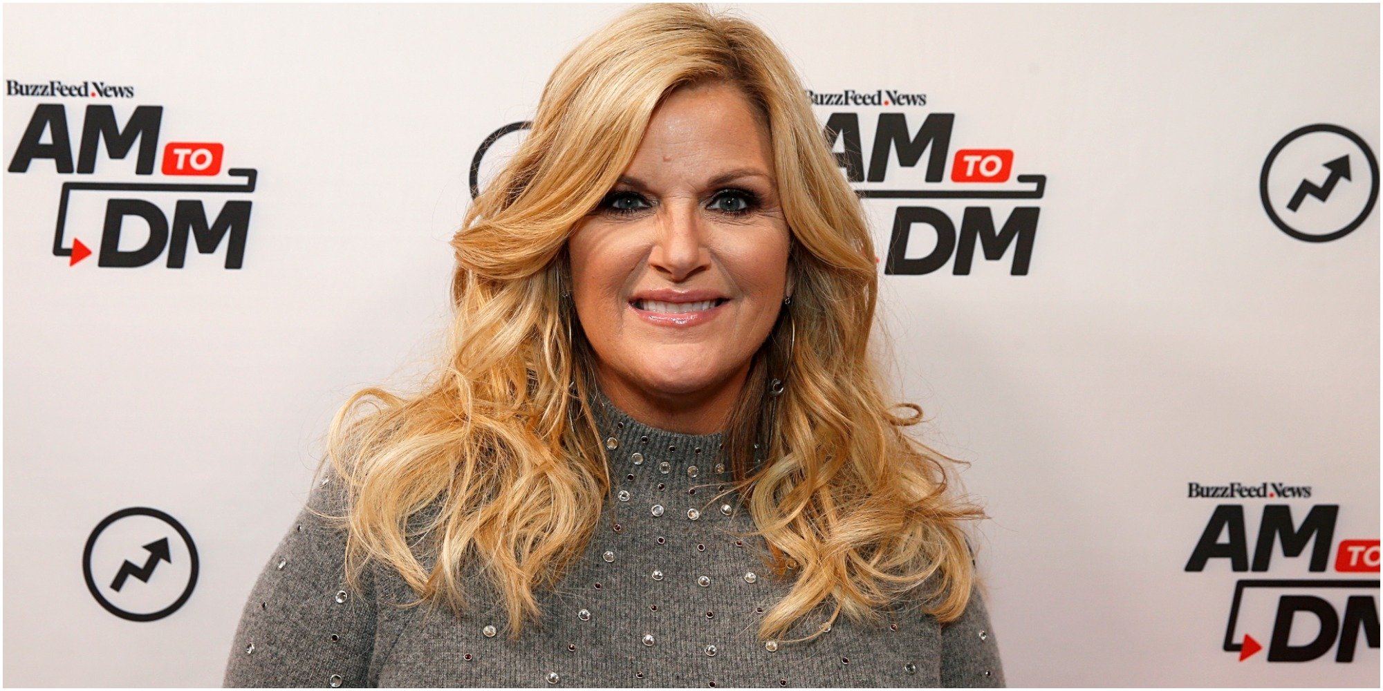 trisha yearwood poses at a red carpet event.