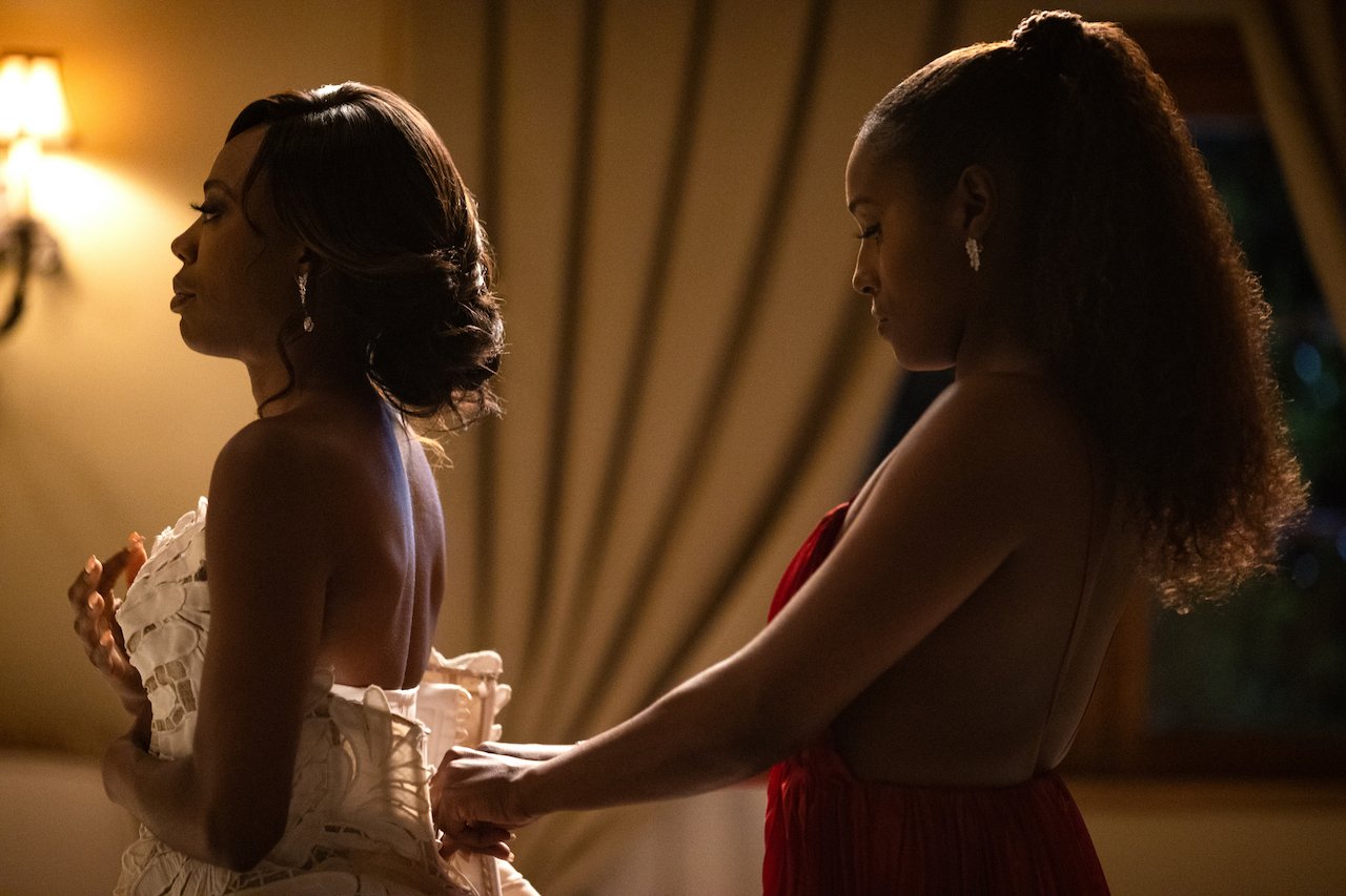 Issa Rae as Issa helps Yvonne Orji as Molly get out of a wedding dress in 'Insecure'.