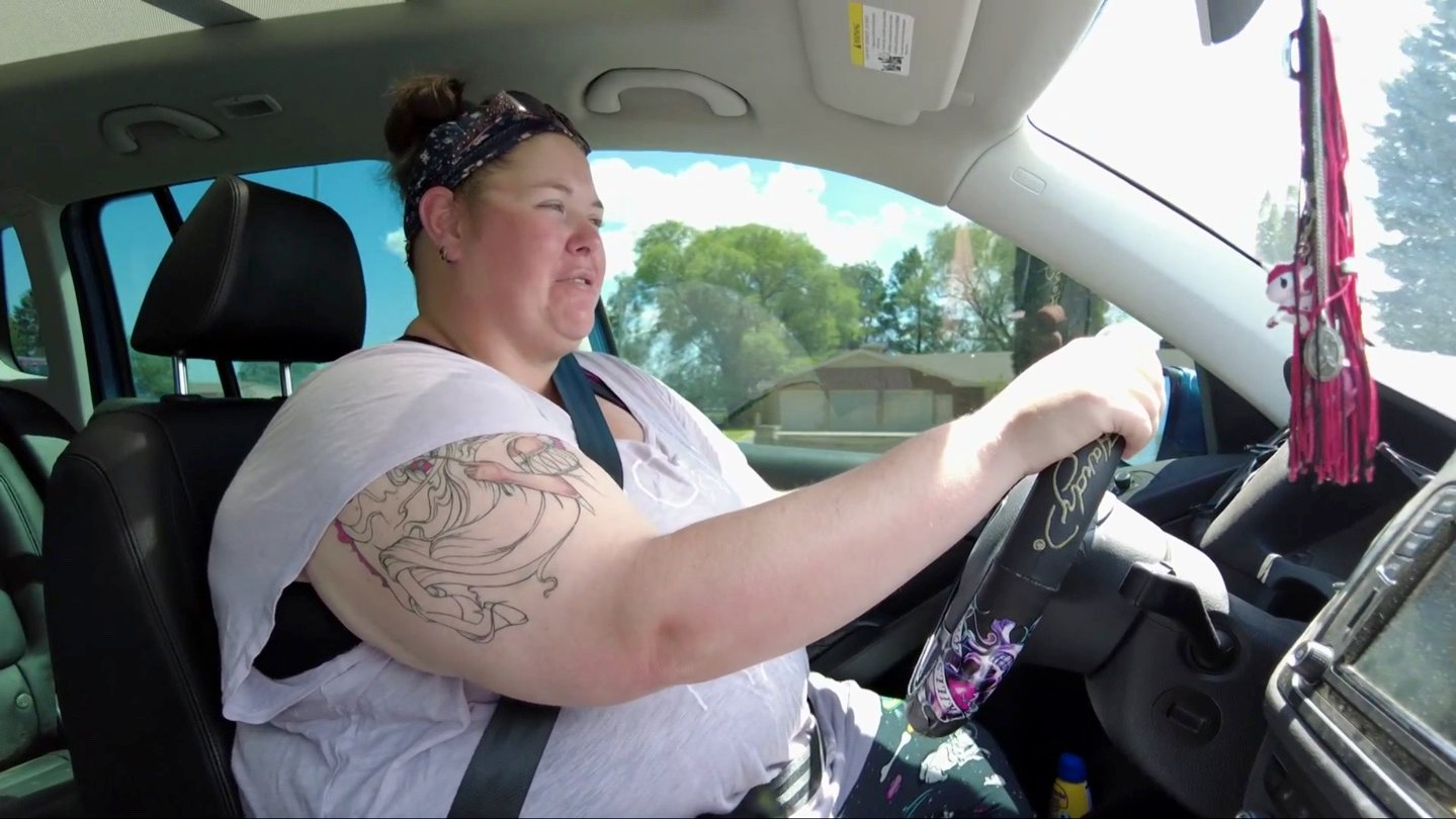 'Before the 90 Days' Season 5 star Ella driving her car in a pink t-shirt in a shot from the Jan. 9, 2022, episode