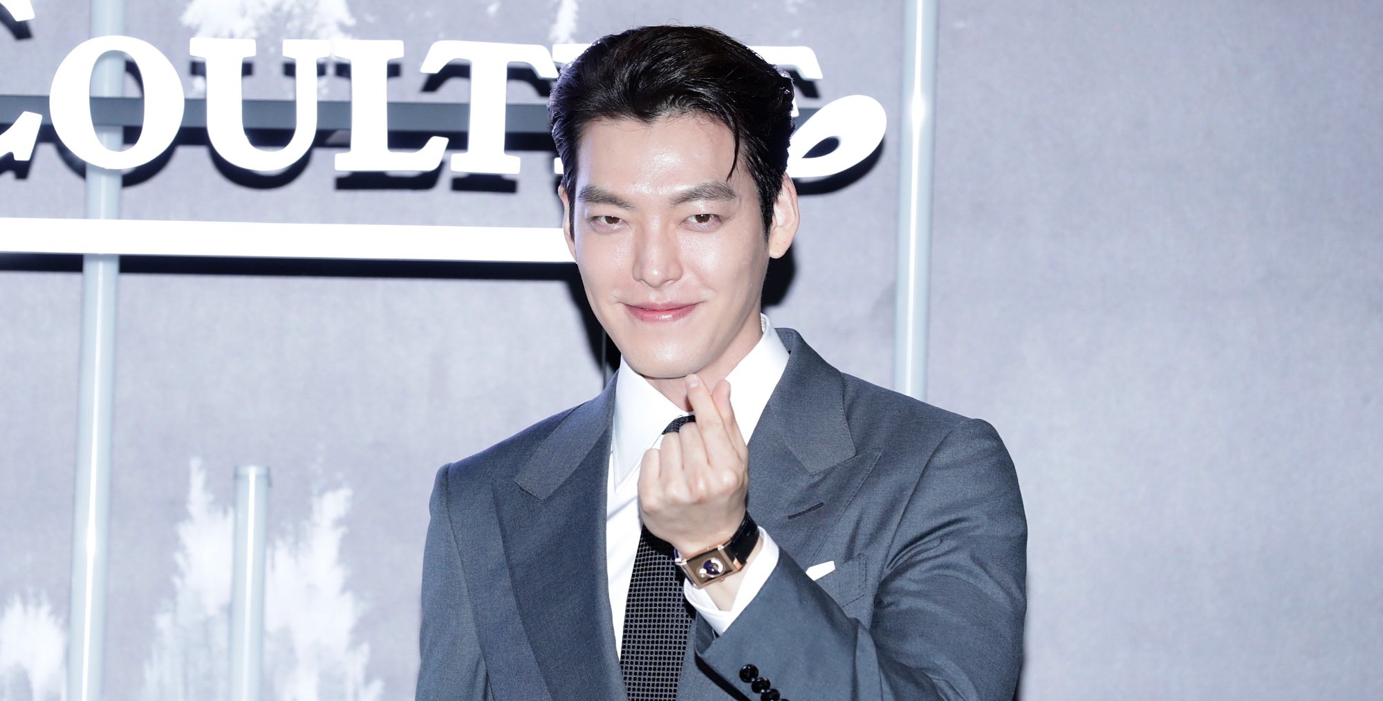Actor Kim Woo-bin who will star in 'Delivery Knight' K-drama wearing a grey suit.