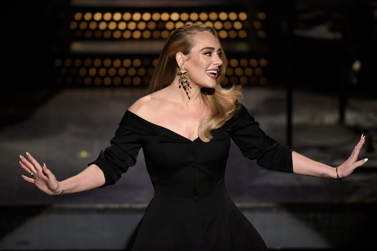 Host Adele  wearing a black dress greets the crowd during the monologue on 'Saturday Night Live'