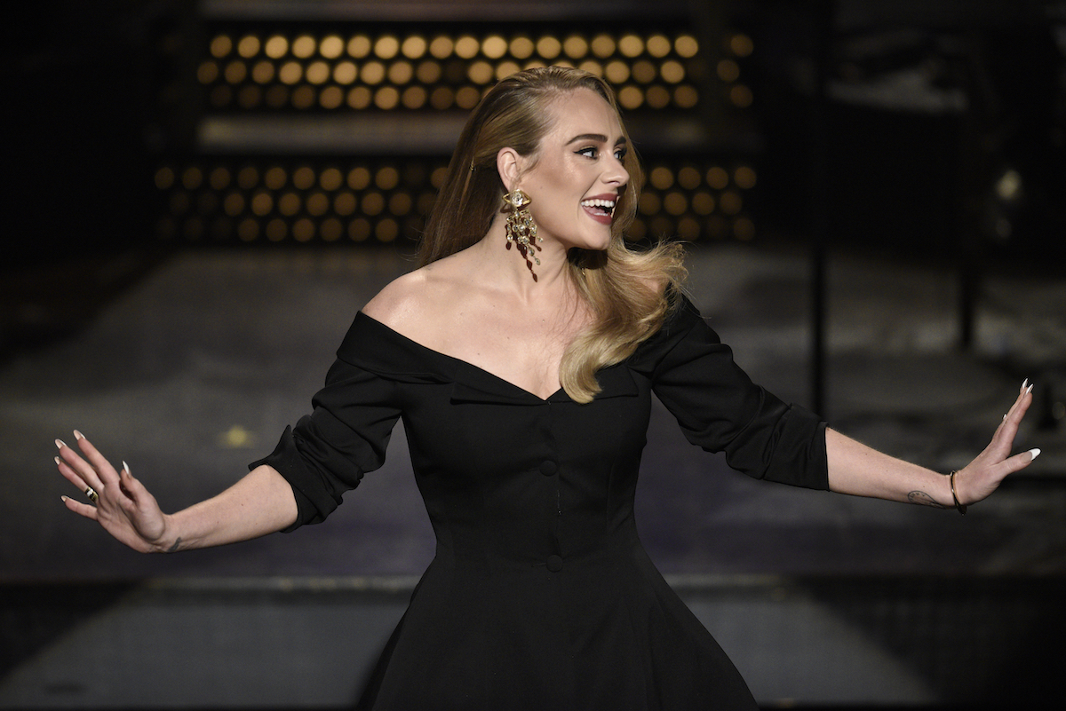 Host Adele  wearing a black dress greets the crowd during the monologue on 'Saturday Night Live'