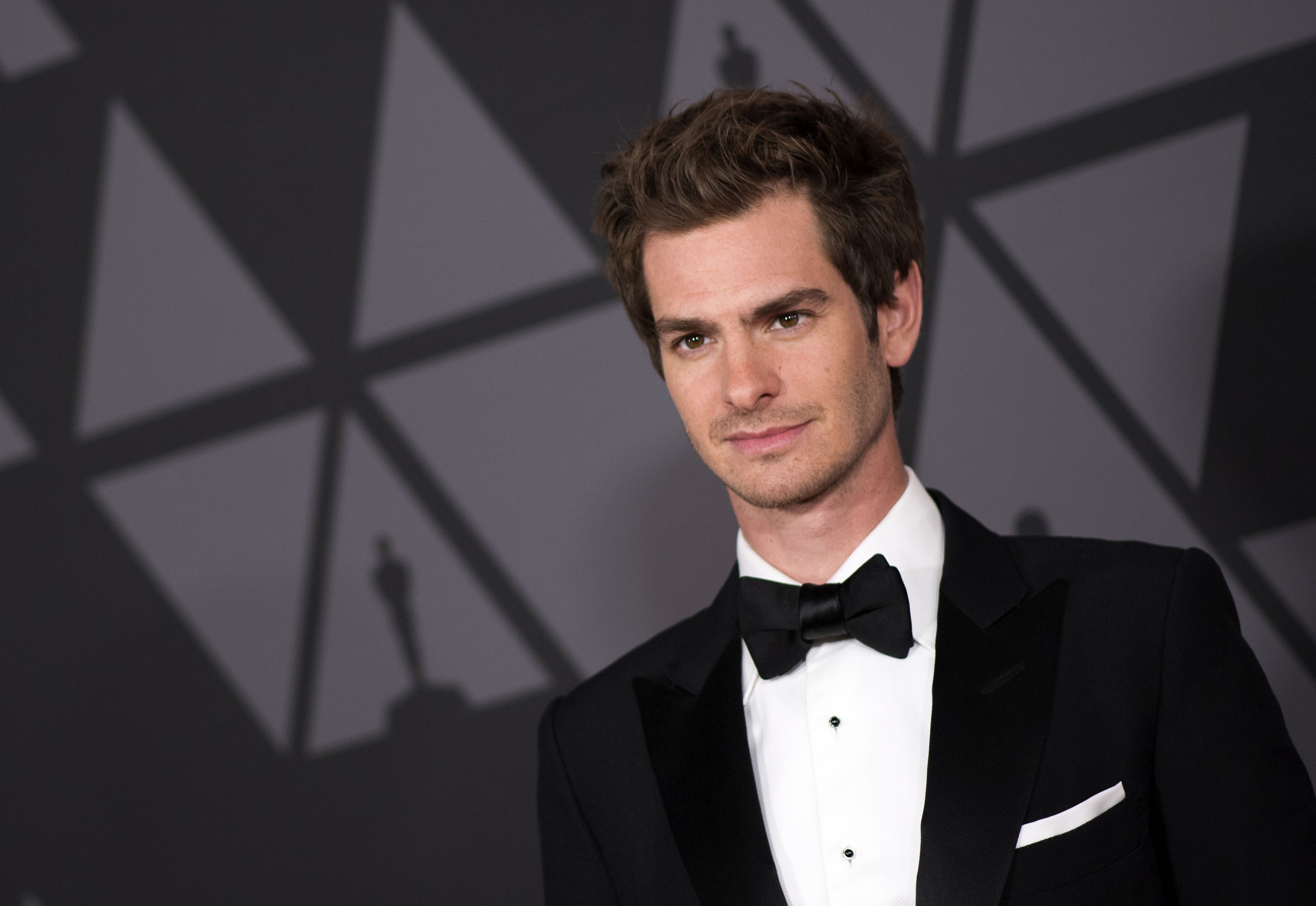 'Spider-Man: No Way Home' star Andrew Garfield wears a black tux with a black bow tie.